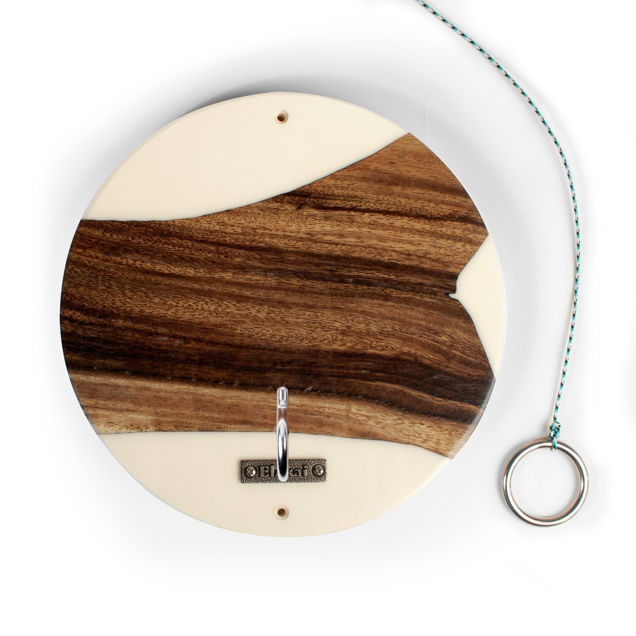 Round wooden wall hook with a natural wood grain inlay and cream-colored borders, featuring a silver metal hook and a hanging ring with a teal cord, shown on a white background.