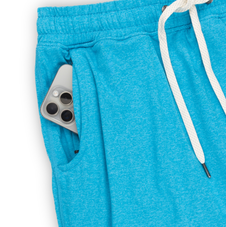 Blue sweatpants with a white drawstring on a white background