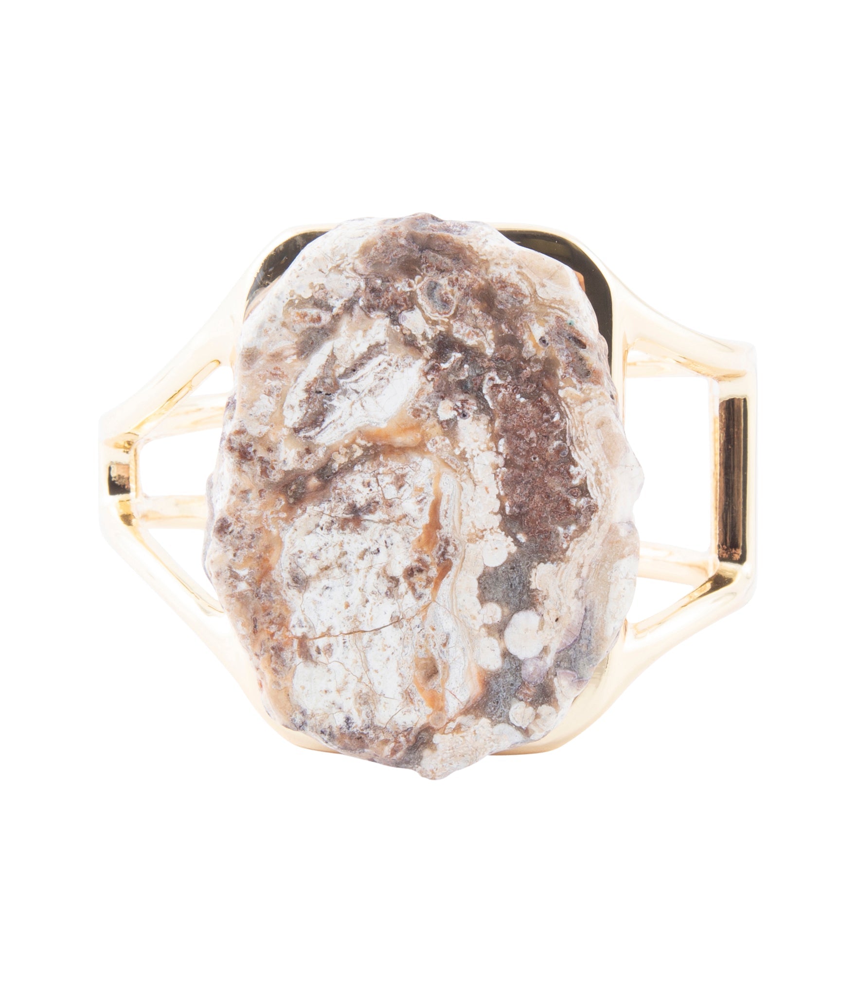 Ring with a natural stone and gold hexagonal band on a white background