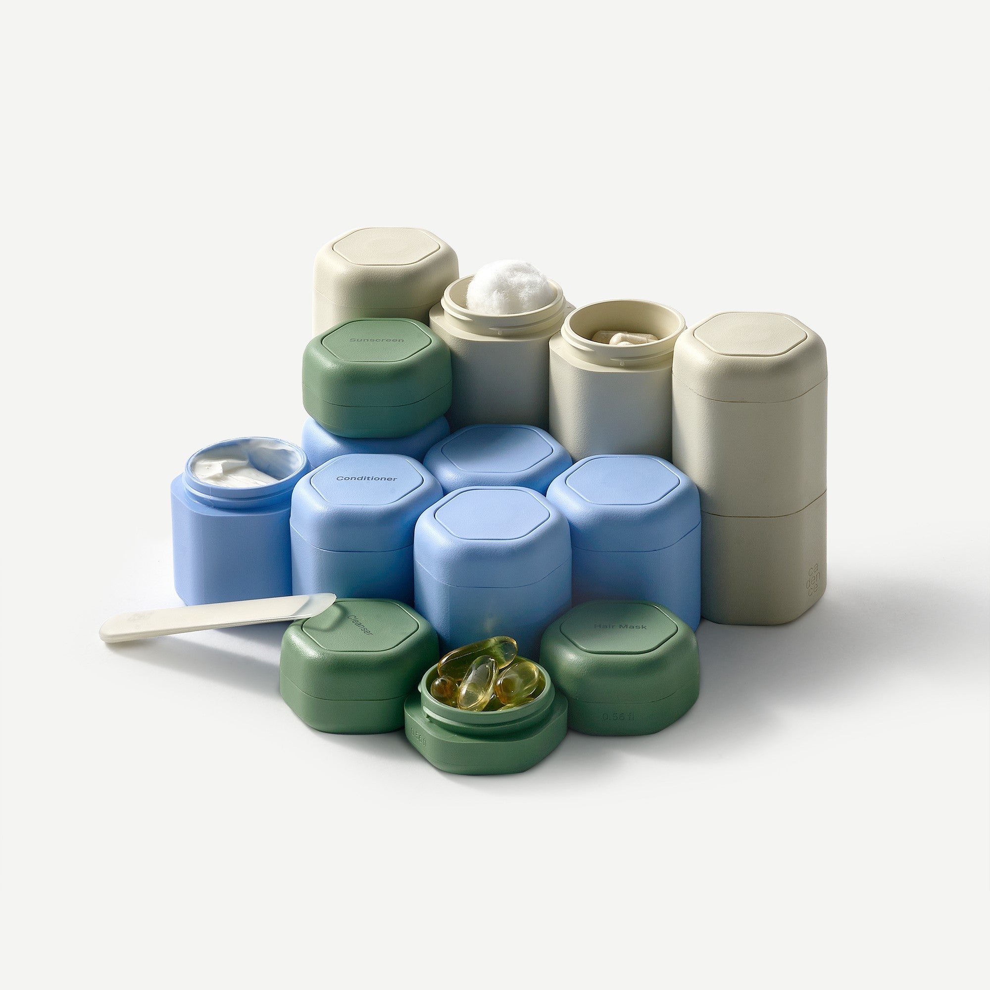 Set of colorful containers with lids on a white background