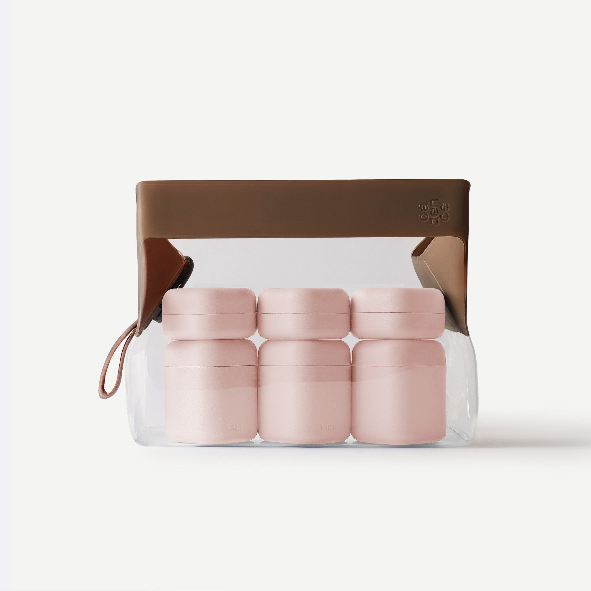 Set of pink containers in a clear packaging with brown lid on a white background