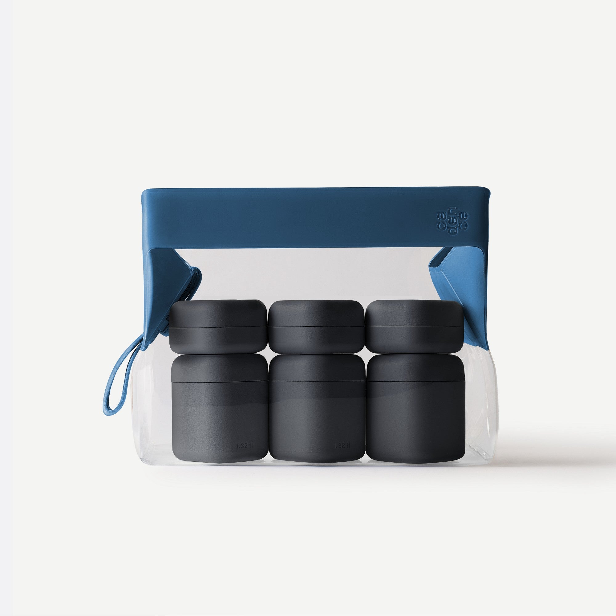 Set of black containers in a clear plastic pack with blue lid on a white background