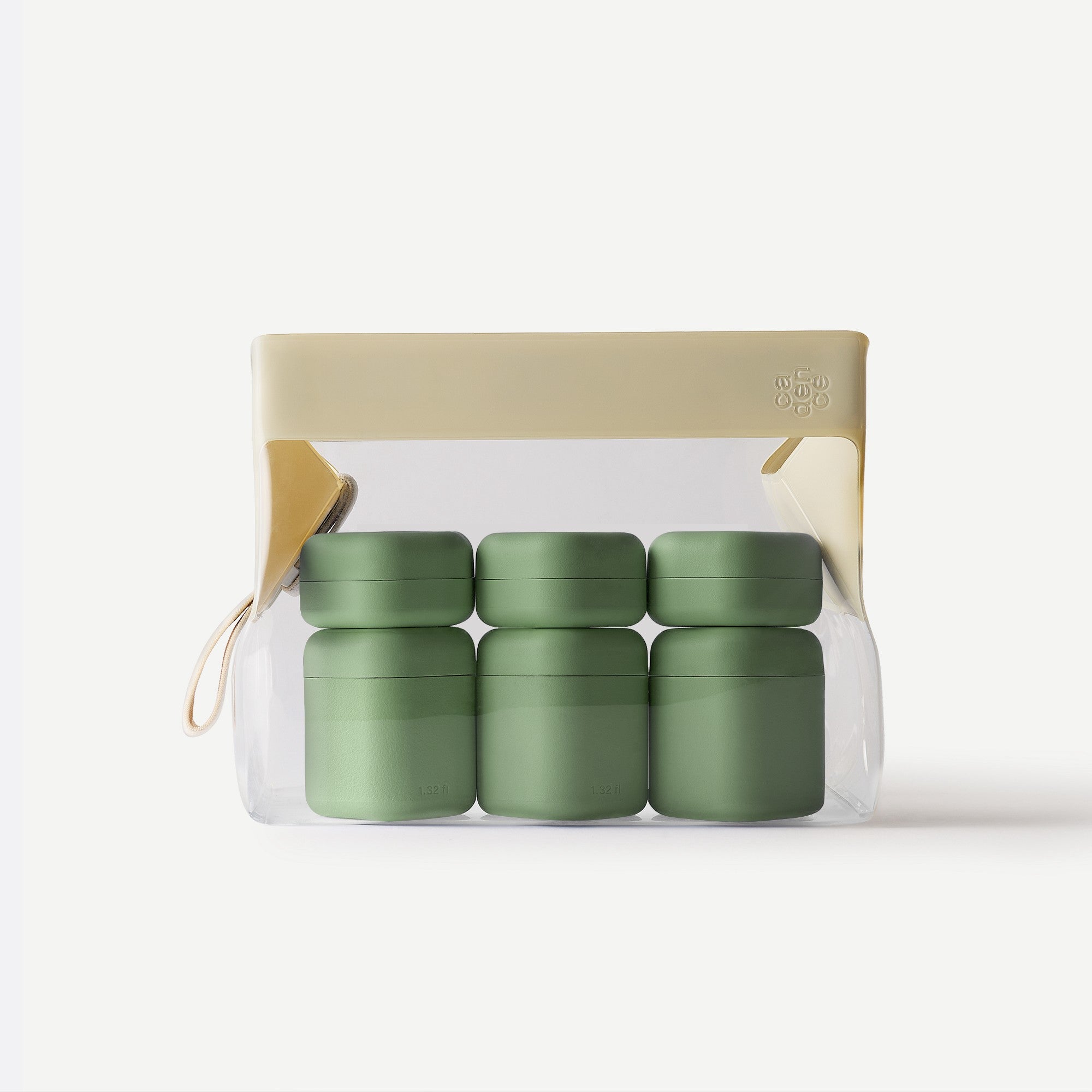 Set of four green containers in a clear packaging with beige lid on a white background