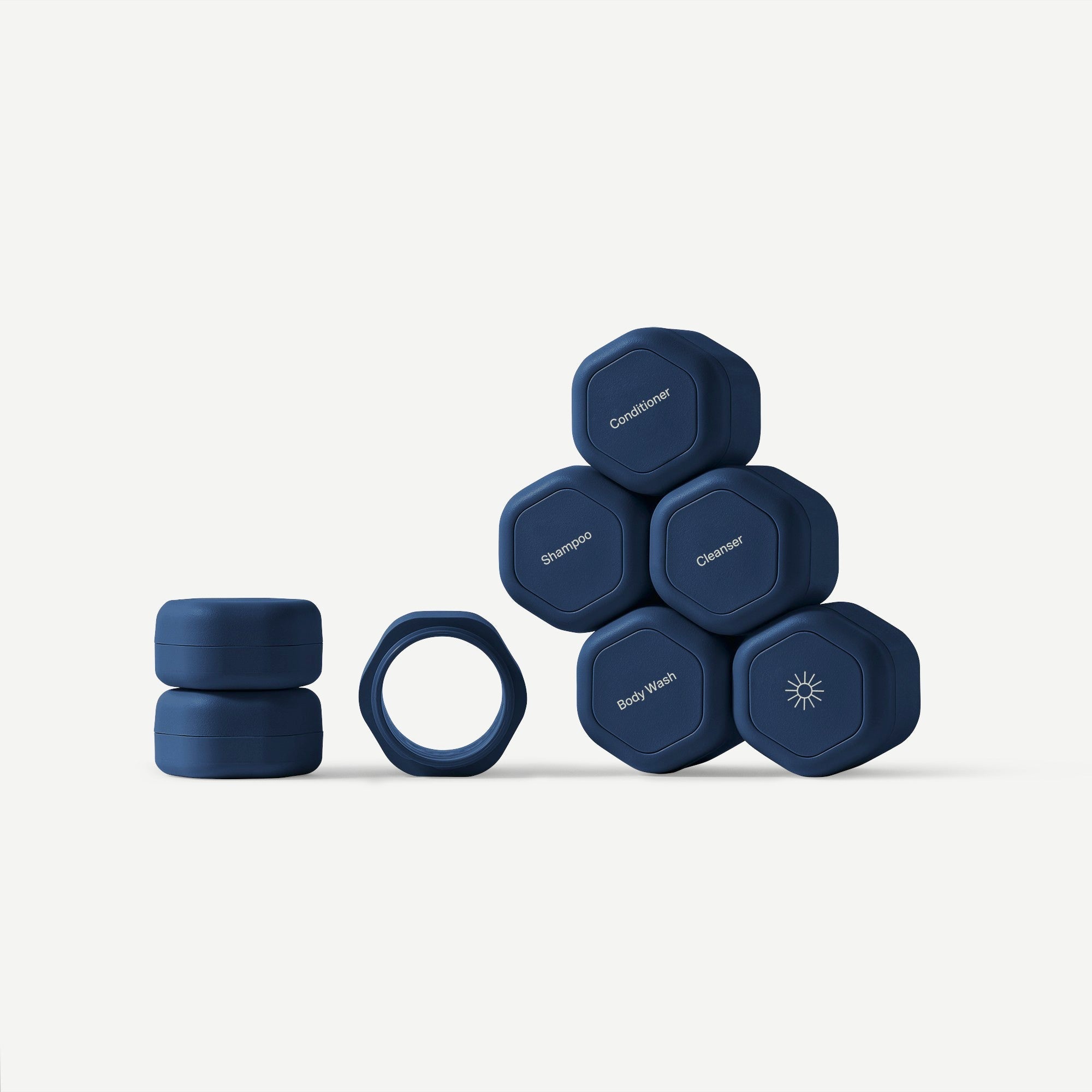 Set of gray hexagonal containers with labels on a white background