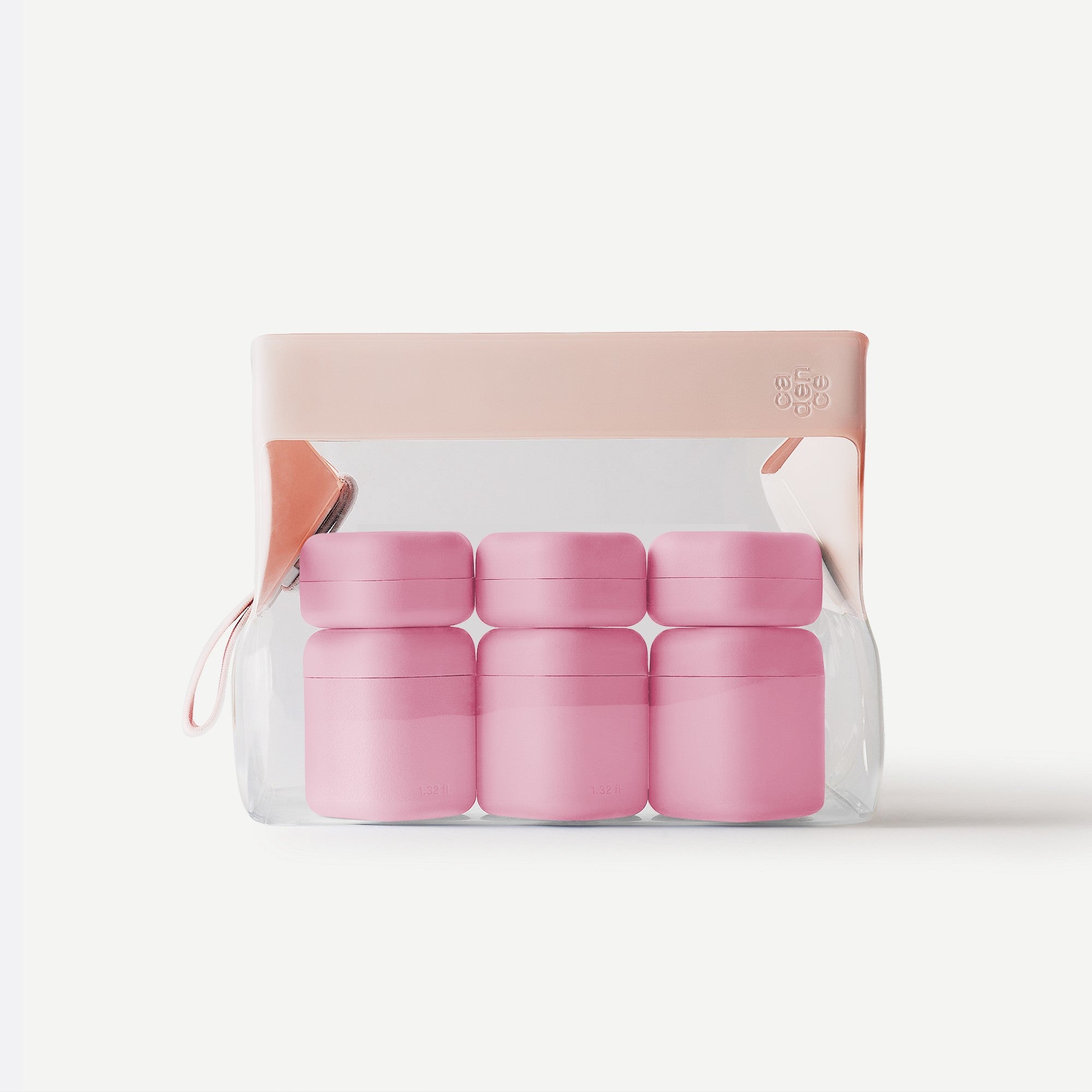 Set of pink containers in a clear packaging on a white background