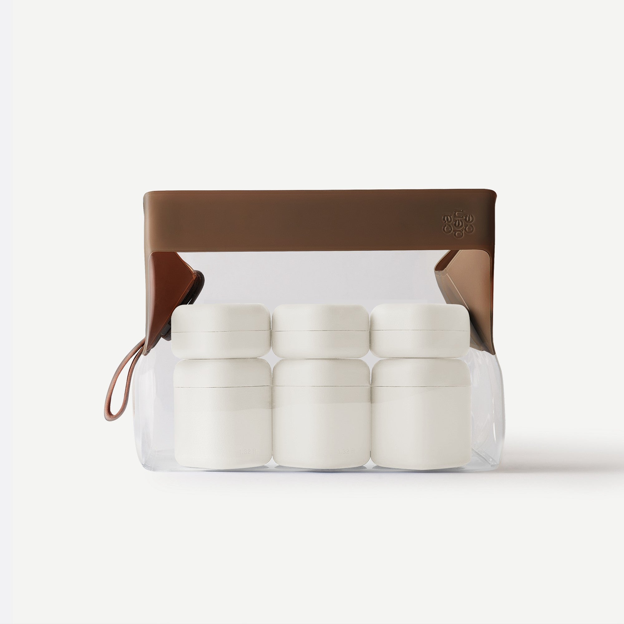 Clear container with white cylindrical items and a brown lid on a white background