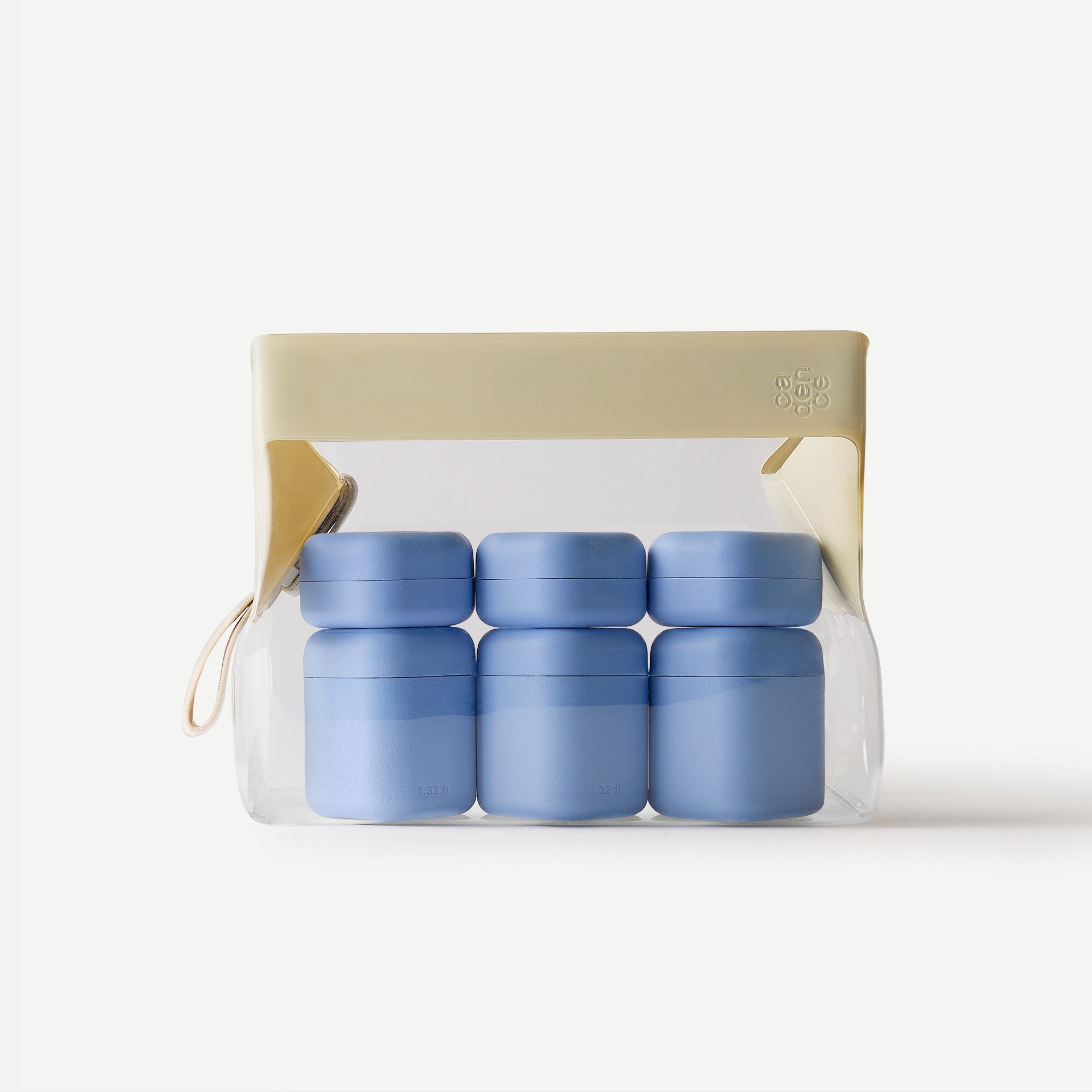 Set of blue containers in a clear plastic pack with beige lid on a white background