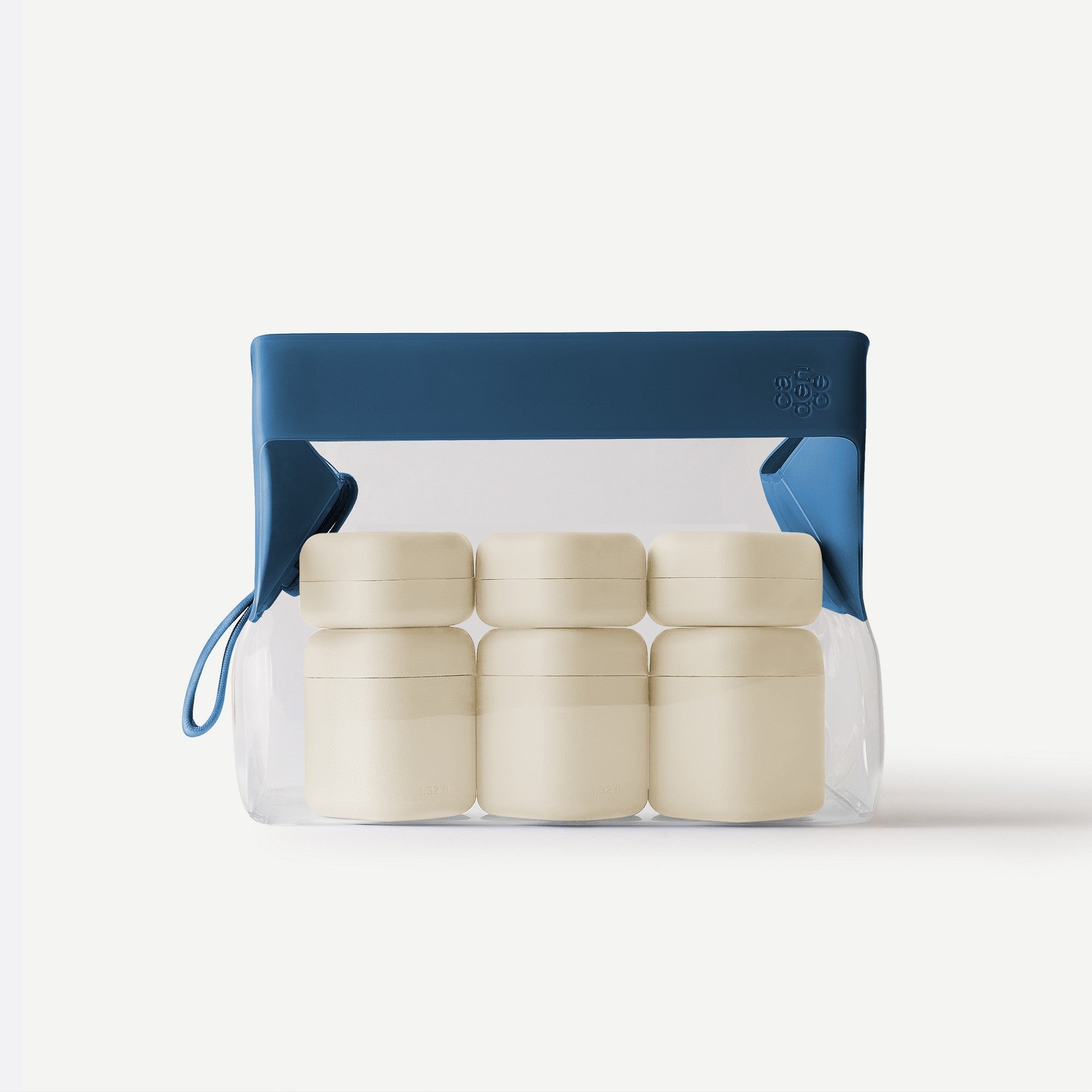 Set of beige containers in a clear plastic bag with a blue handle on a white background