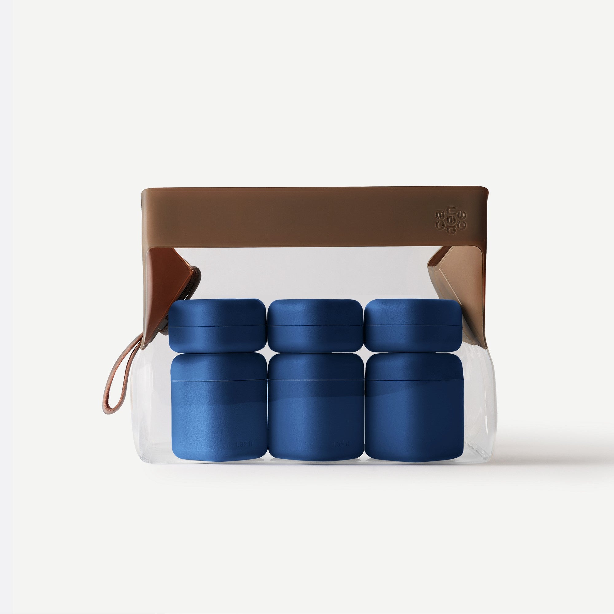 Set of blue containers in a clear plastic pack with a brown leather strap on a white background