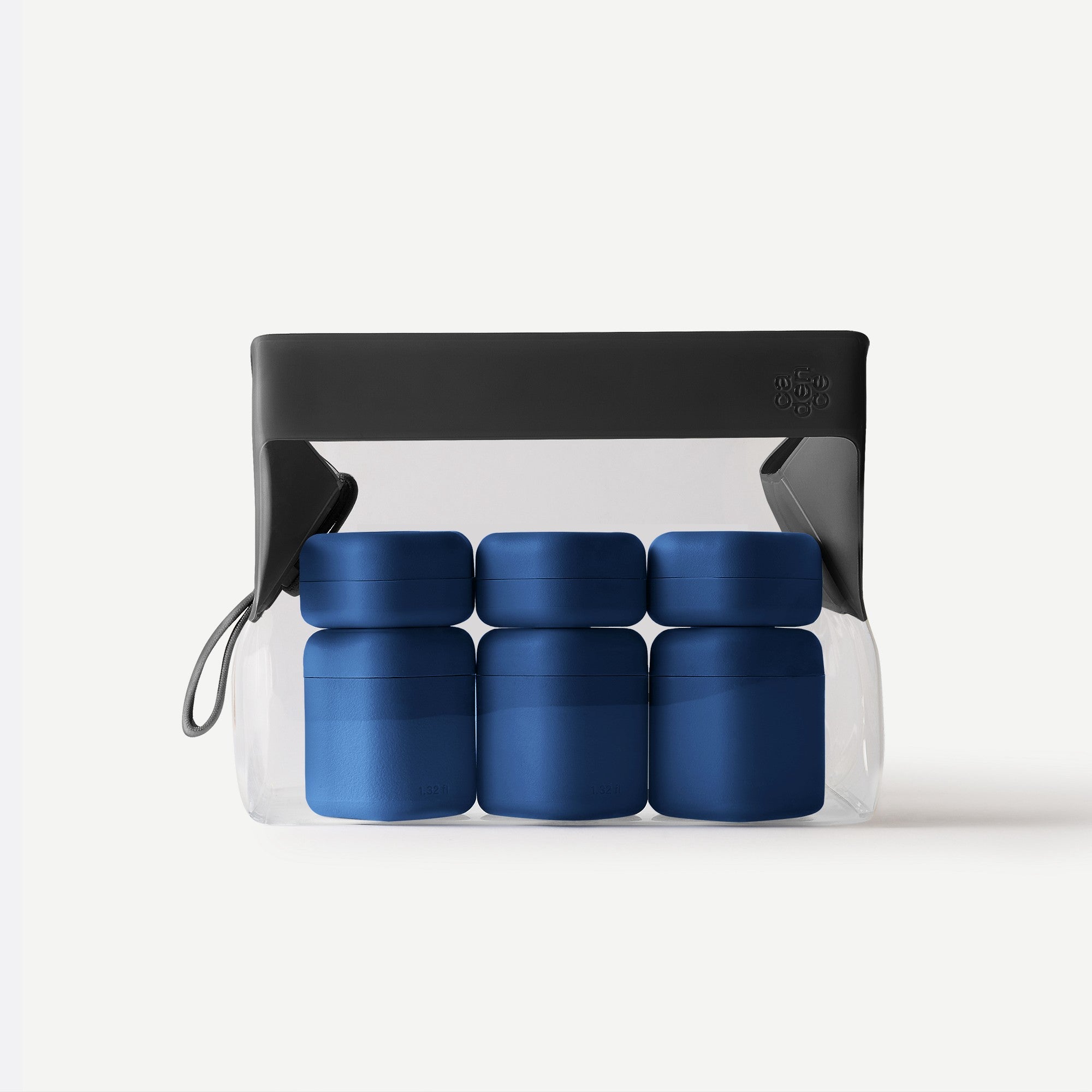 Set of blue containers in a clear plastic bag with a black carrying handle on a white background