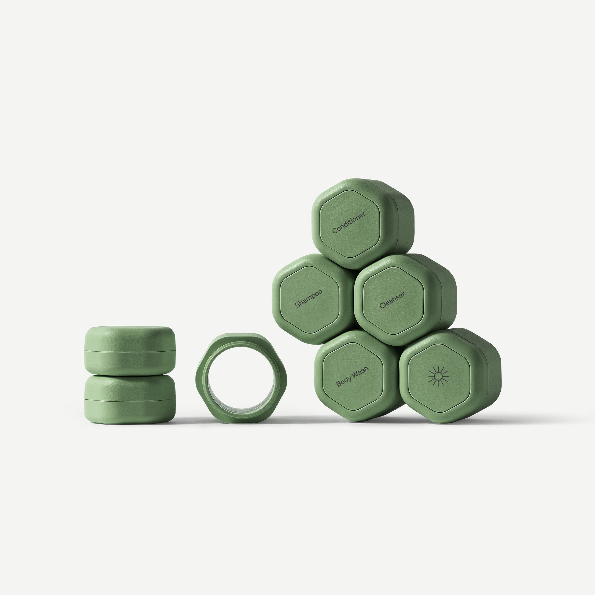 Set of gray hexagonal containers with labels on a white background