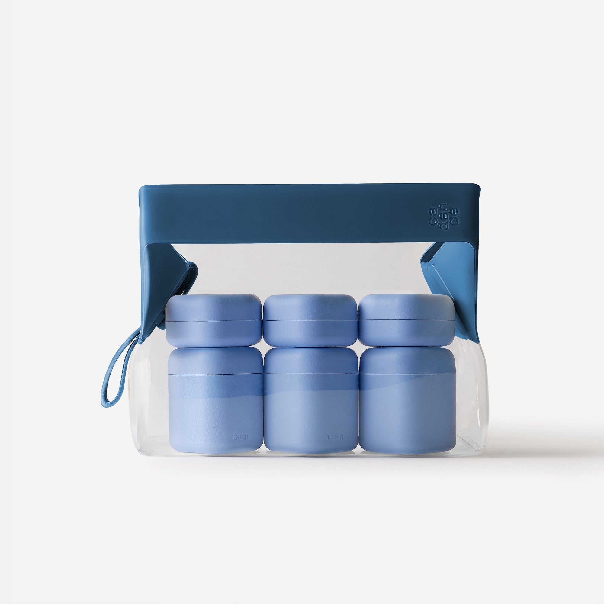 Set of blue containers in a clear plastic bag with a blue lid on a white background
