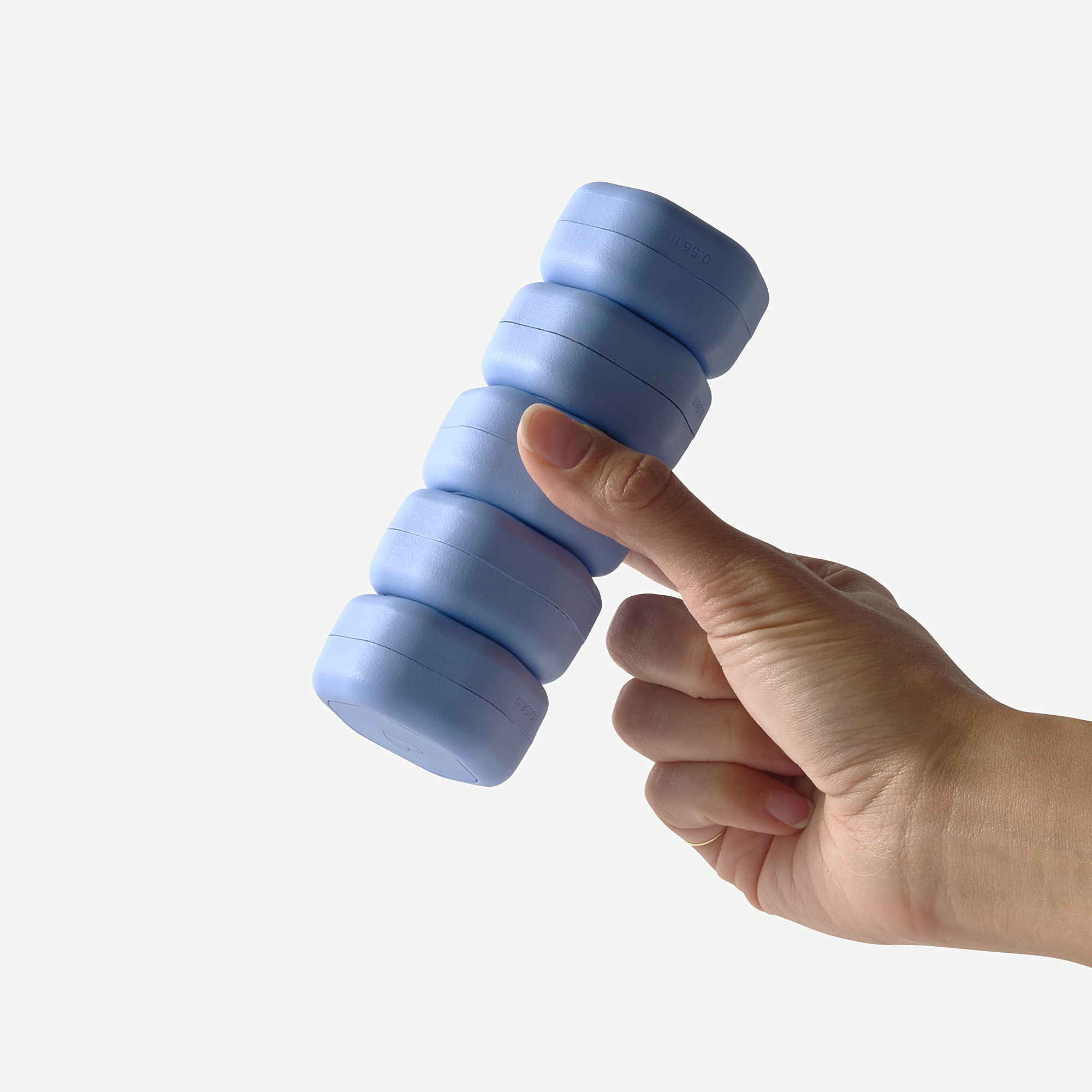 Hand holding a blue dumbbell against a white background