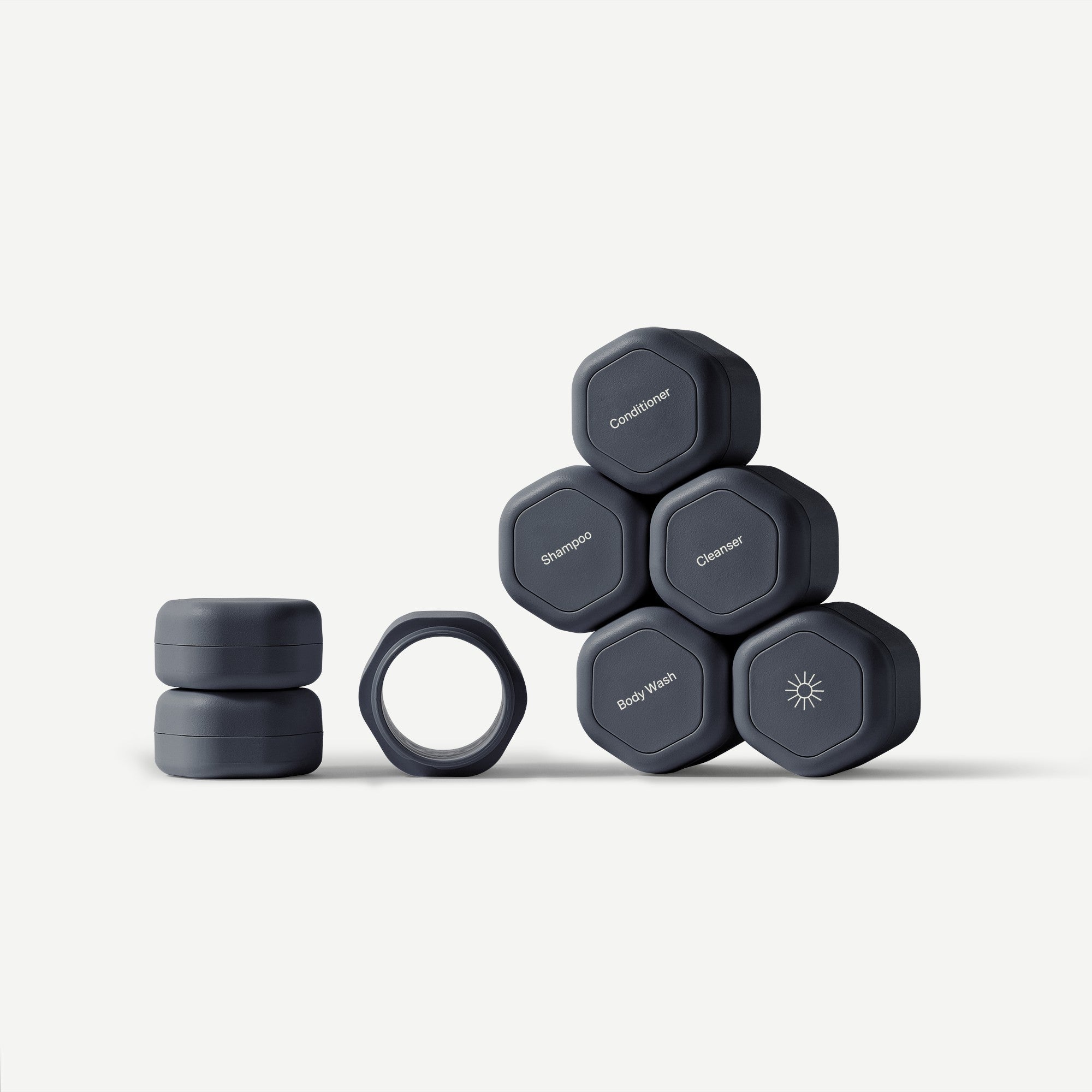 Set of gray hexagonal containers with labels on a white background