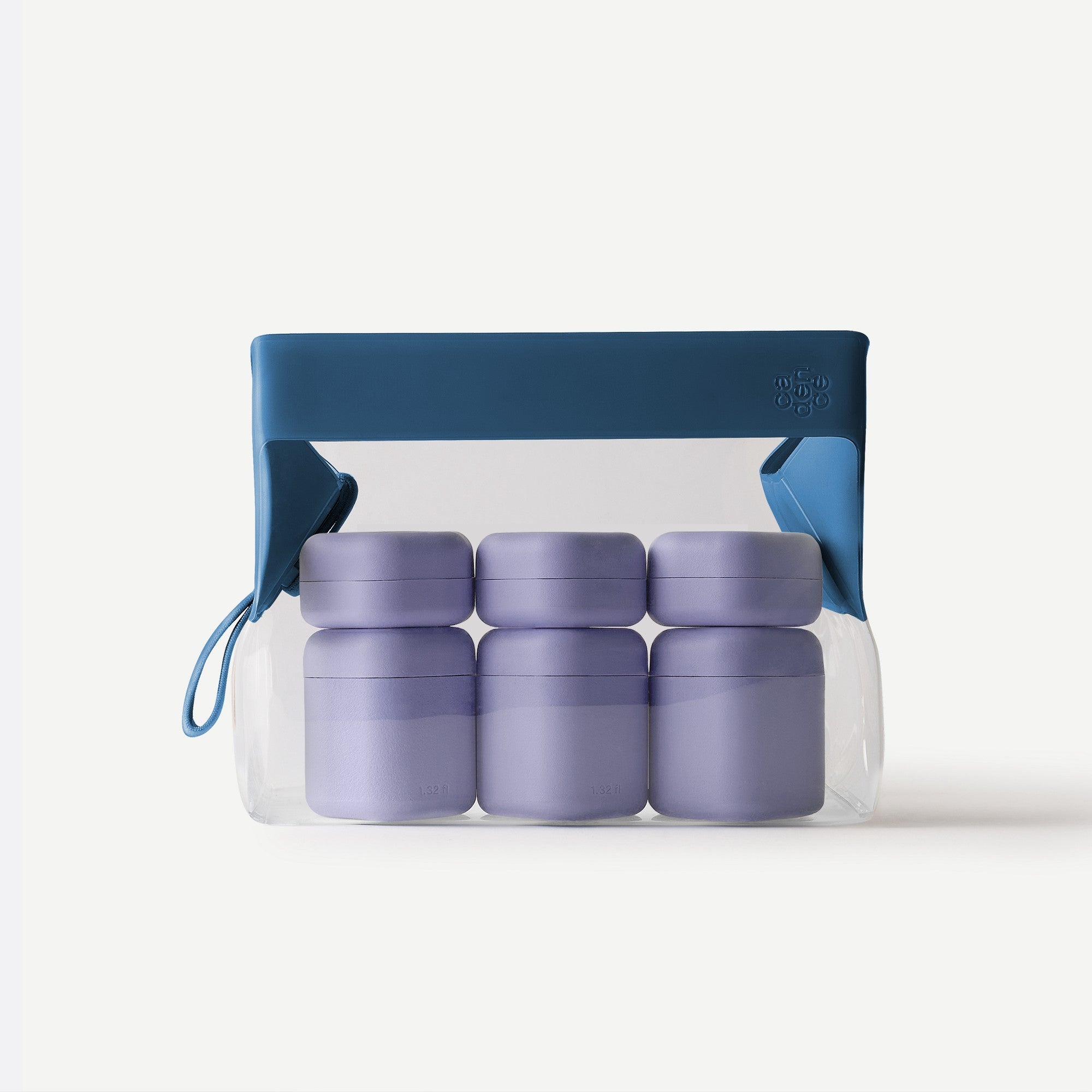 Set of purple containers with a blue carrying case on a white background