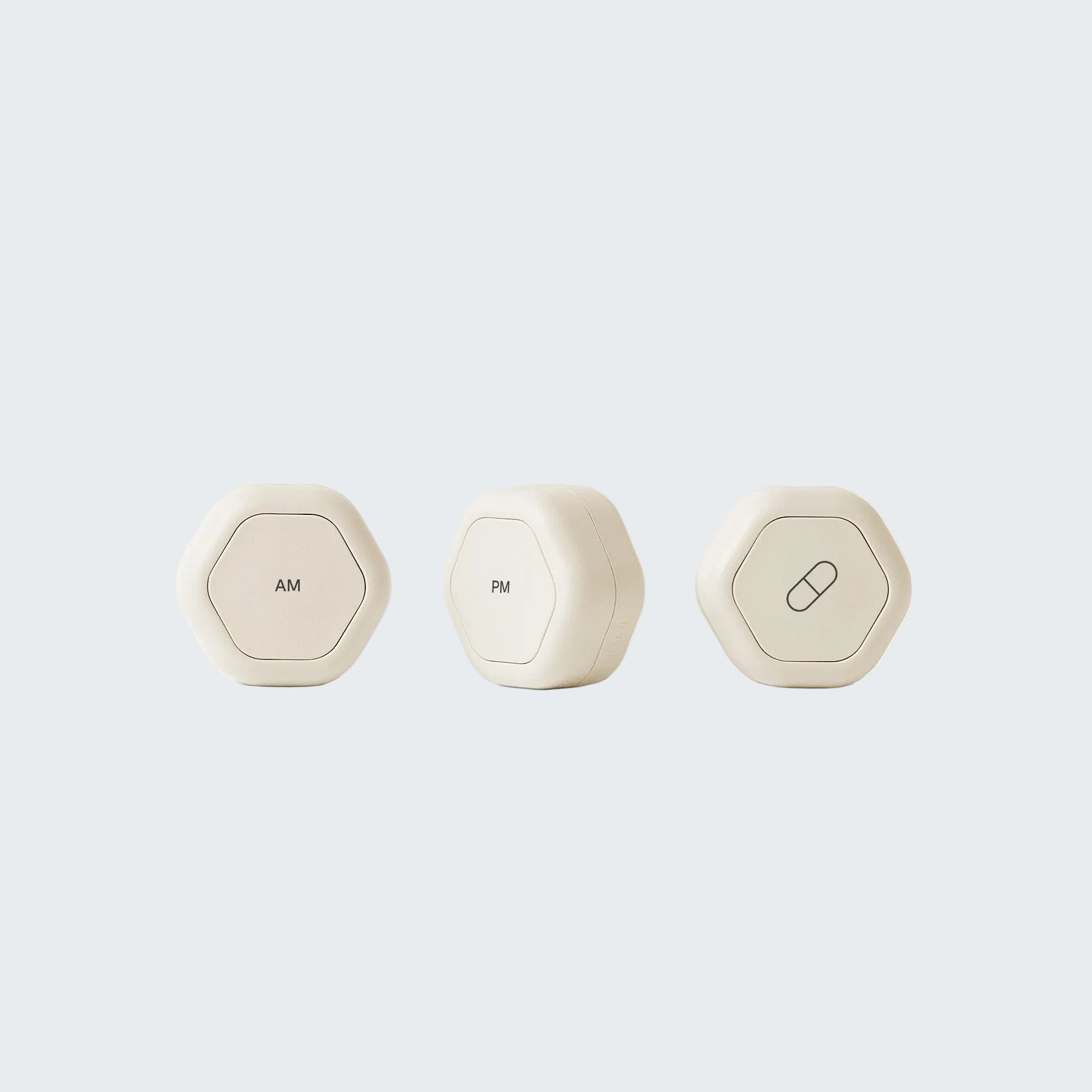 Three white hexagonal containers labeled 'Hair Serum', 'Hair Gel', and 'Lumin' on a white background.