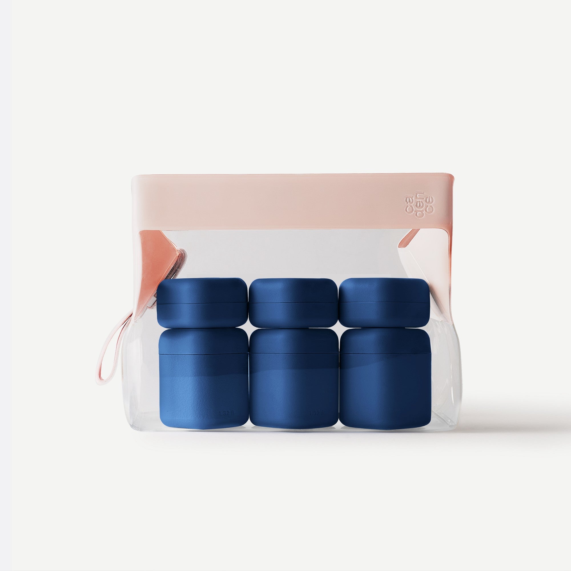 Set of four green containers in a clear package with a pink lid on a white background