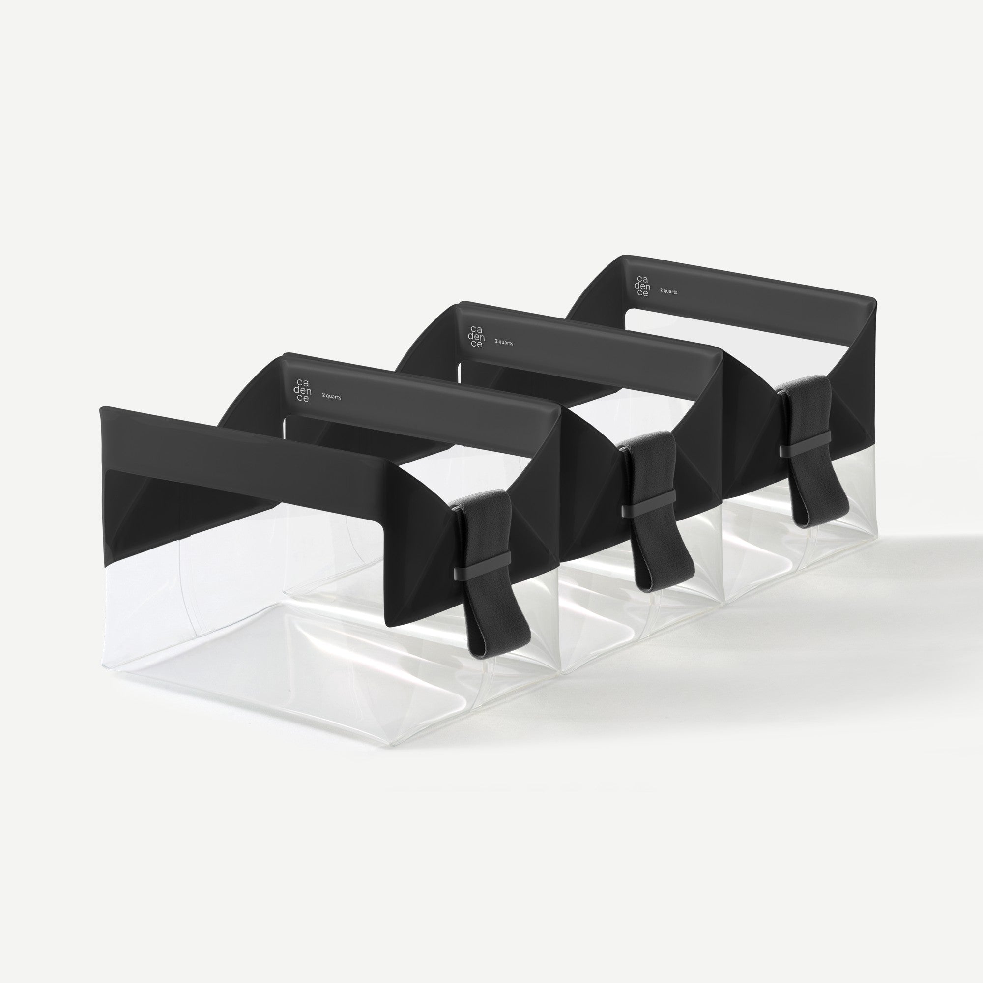 Set of black bow ties on a clear stand against a white background