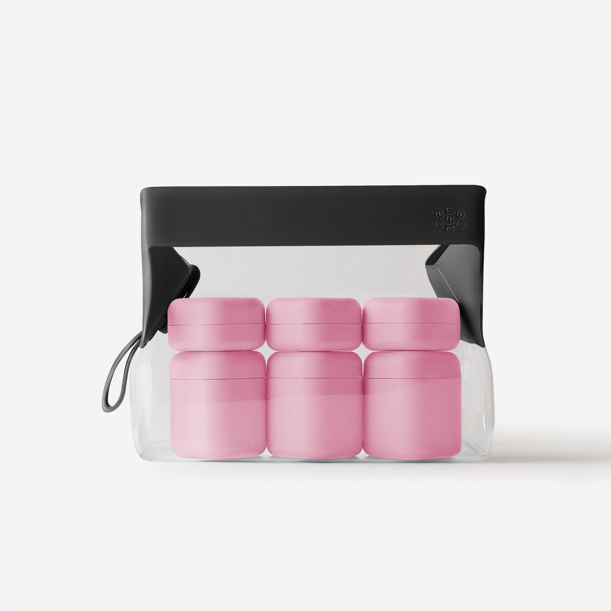 Set of pink containers in a clear plastic pack with a black lid on a white background