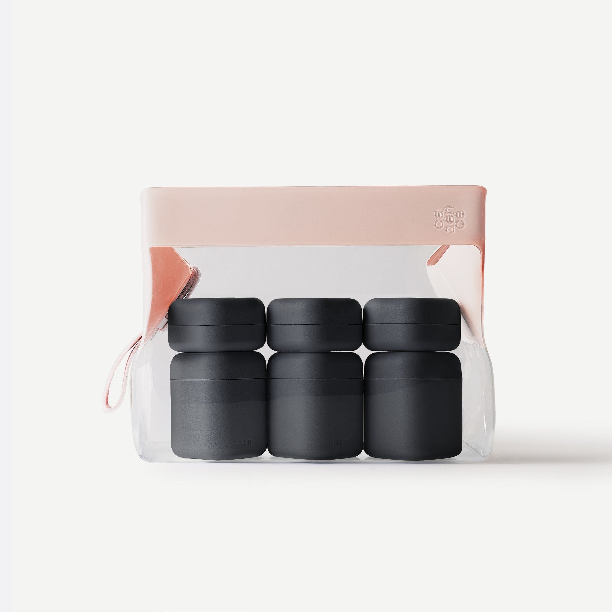 Set of four green containers in a clear package with a pink lid on a white background