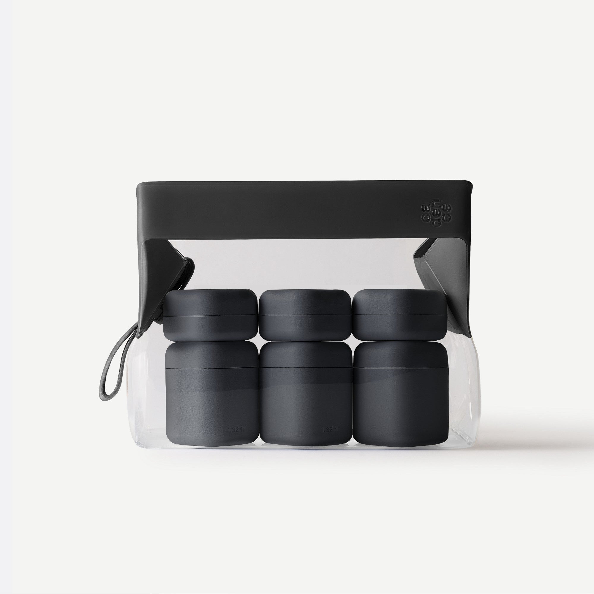 Set of black containers with a clear plastic bag on a white background