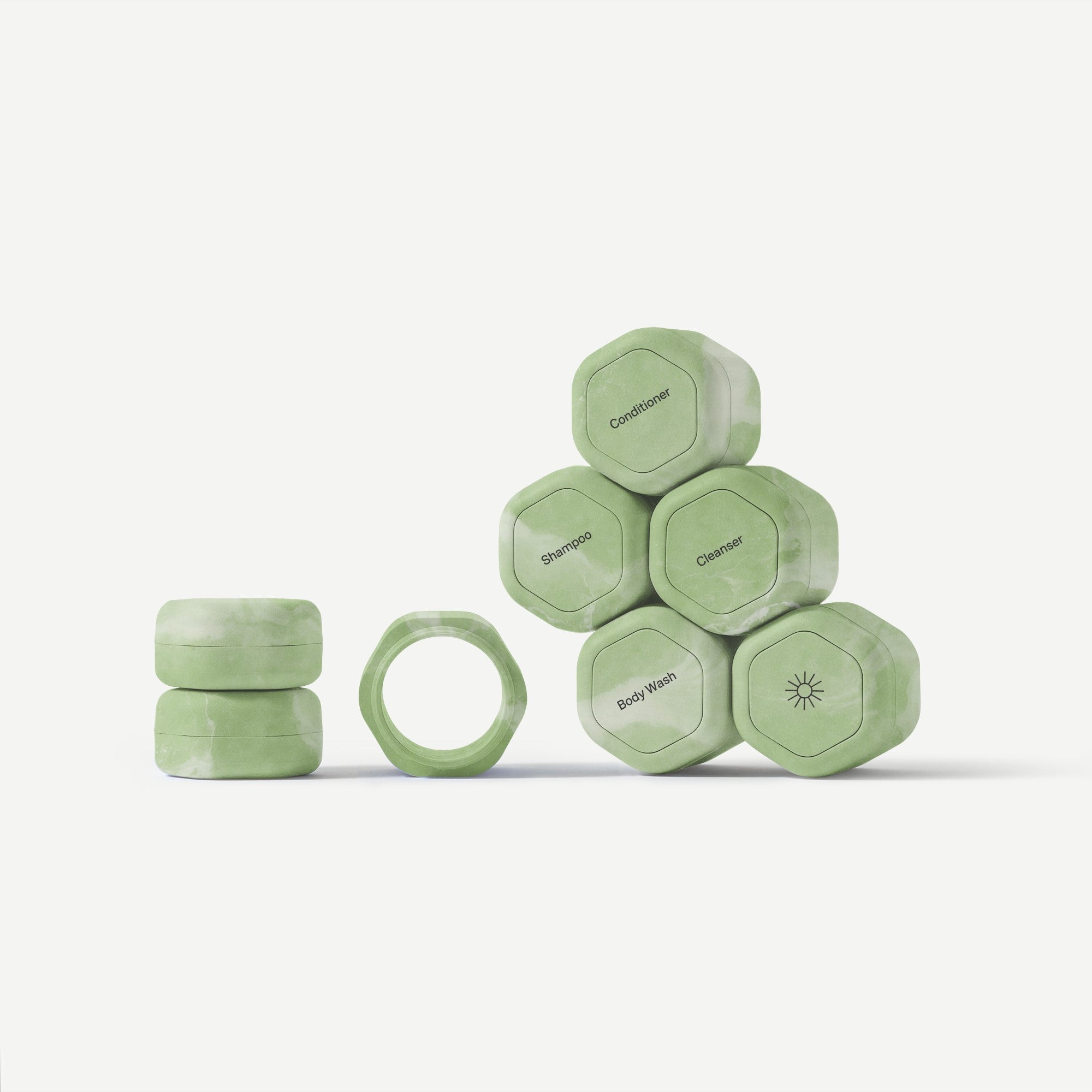 Set of green hexagonal bottles with 'Cafelat' branding on a white background