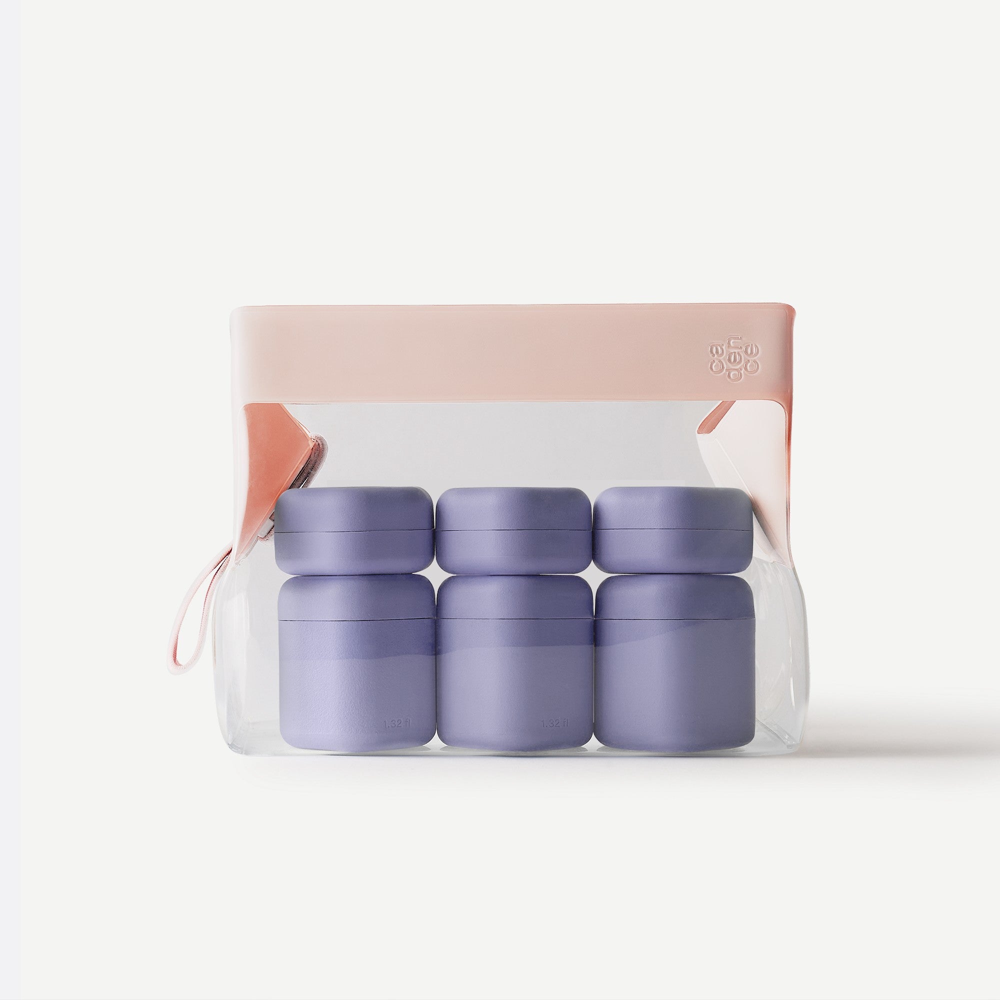 Set of four green containers in a clear package with a pink lid on a white background