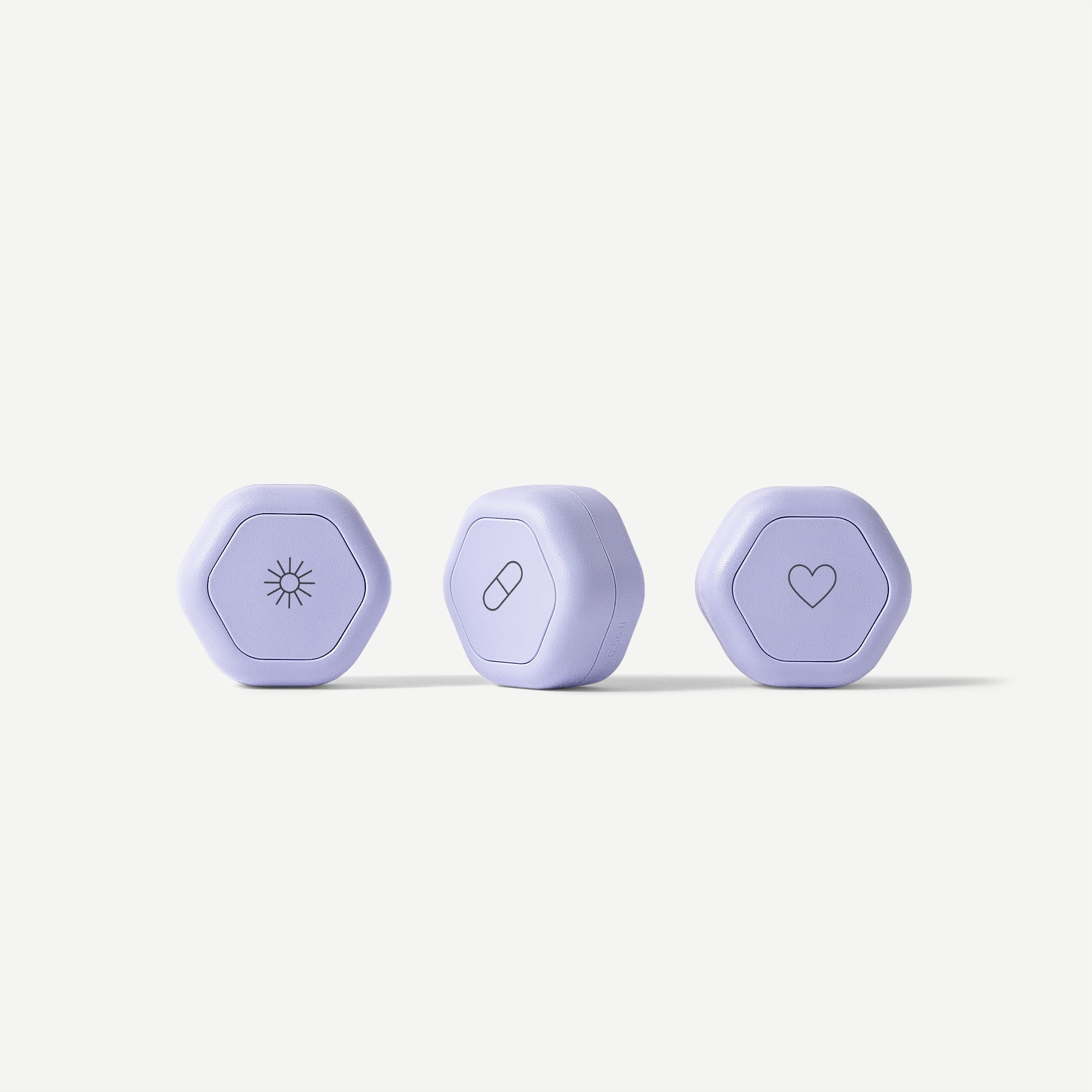 Three purple hexagonal devices with different symbols on a white background