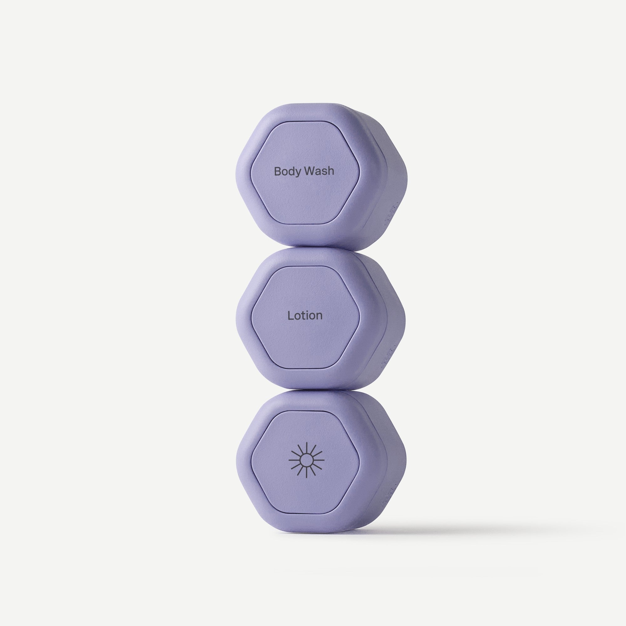 Three purple hexagonal containers labeled 'Body Wash', 'Lotion', and 'Sunscreen' on a white background