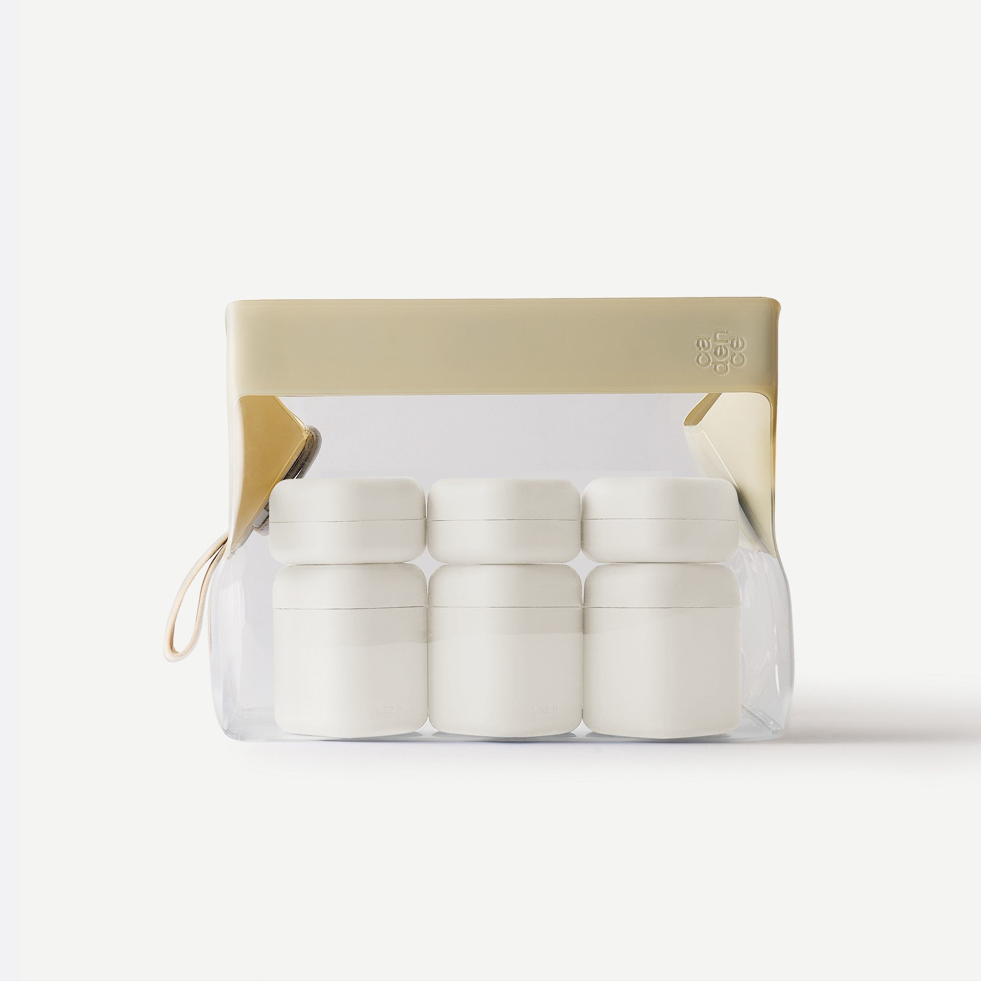 Set of white containers in a clear plastic pack with beige lid on a white background