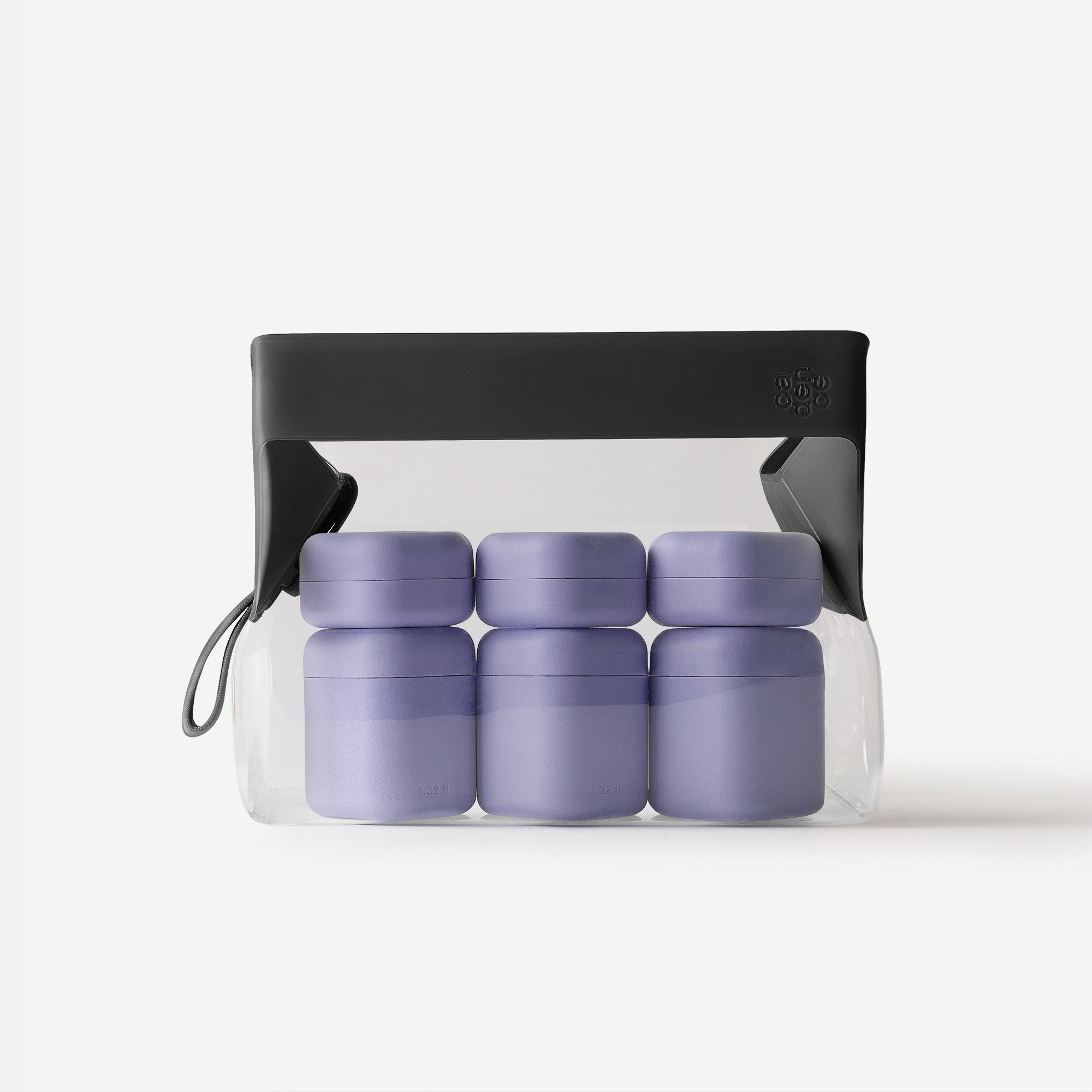 Set of purple containers with a black lid in a clear plastic bag on a white background