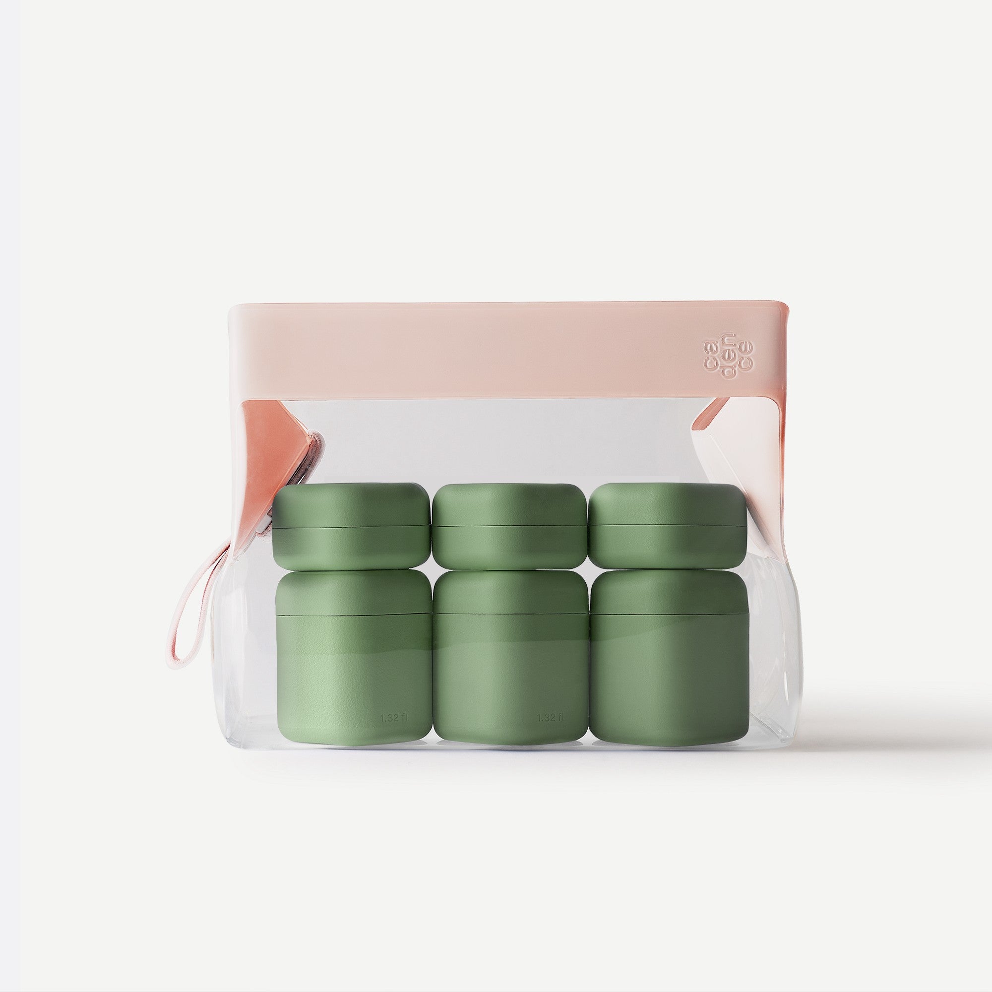 Set of four green containers in a clear package with a pink lid on a white background