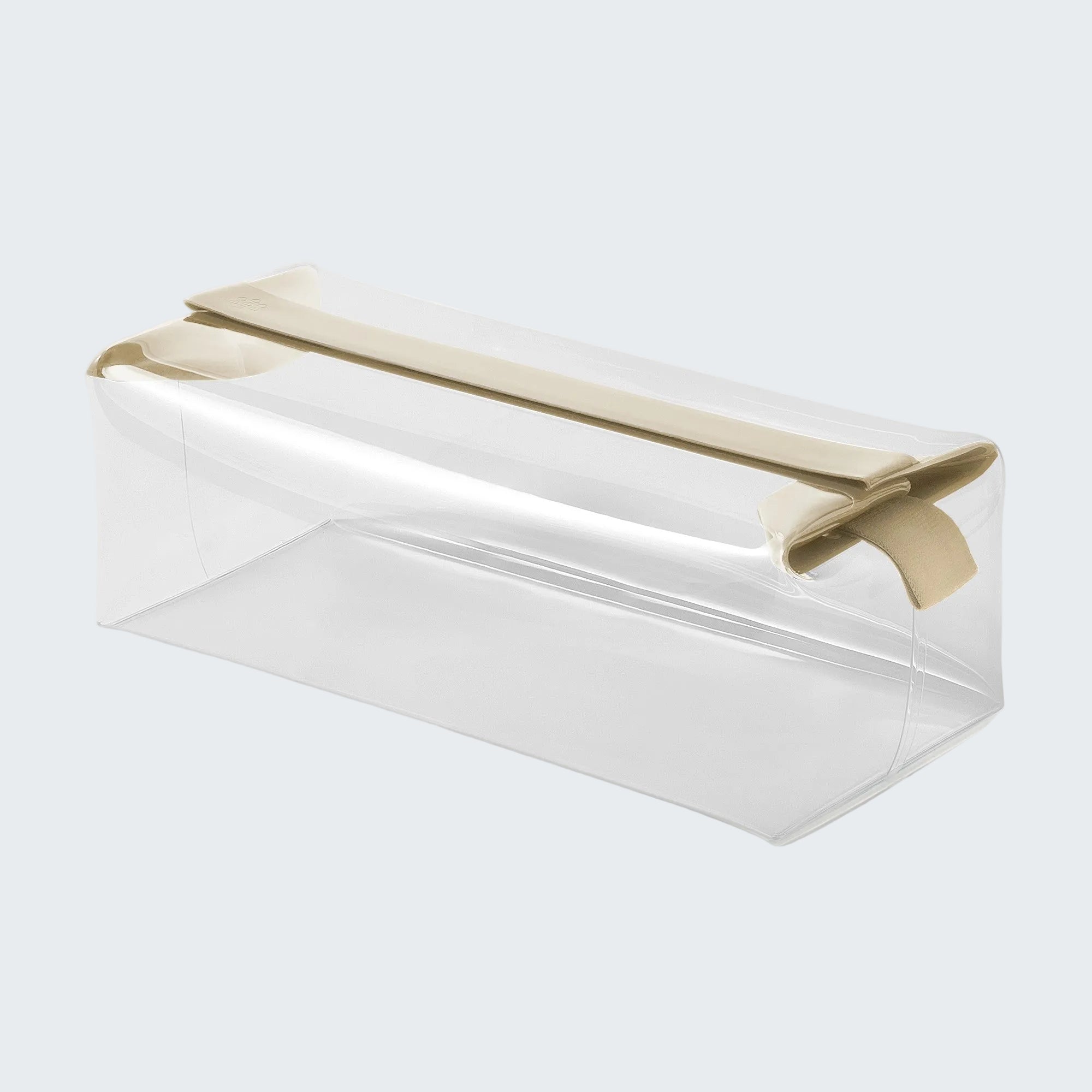 Clear rectangular container with a gold lid on a white background