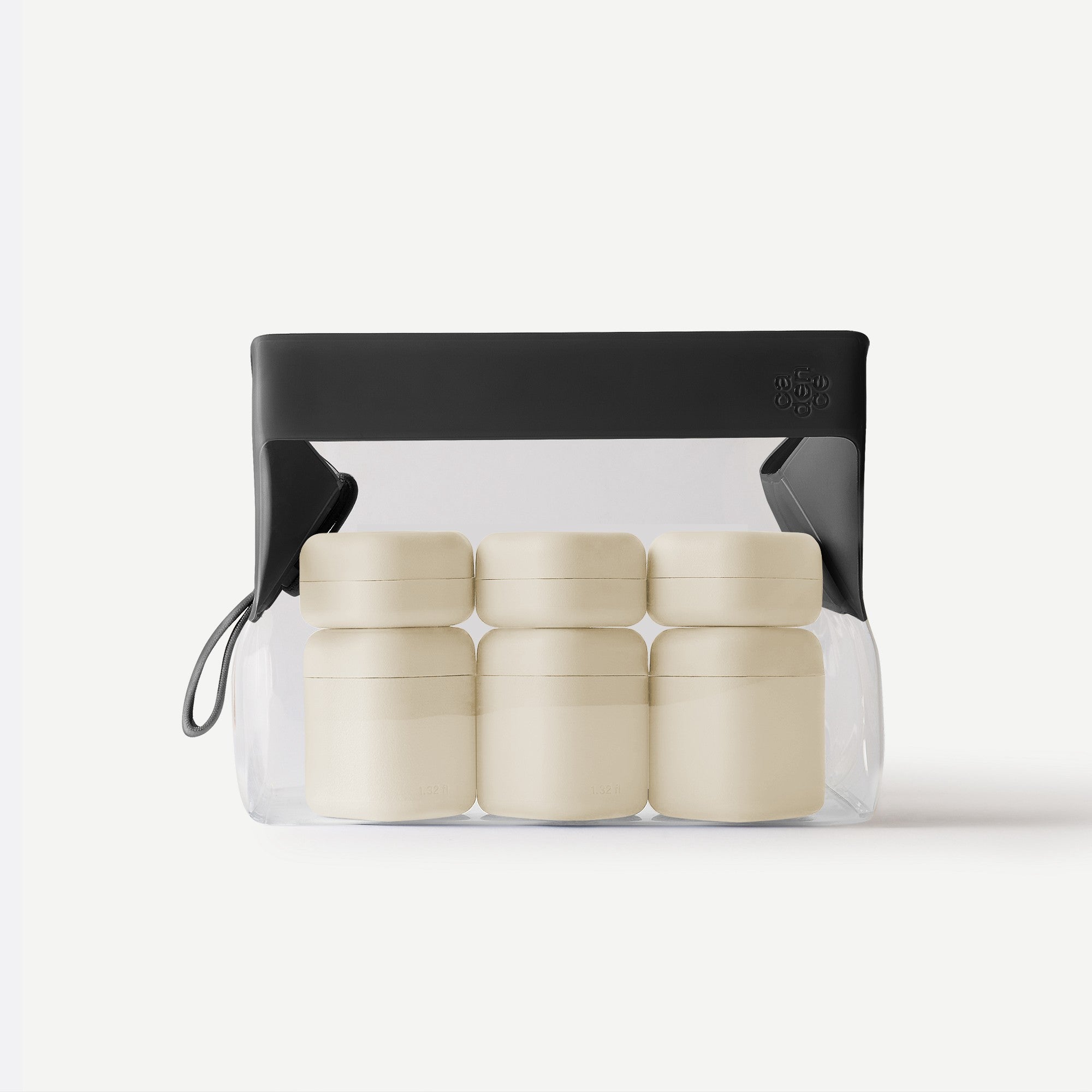 Set of beige containers in a clear plastic pack with a black lid on a white background