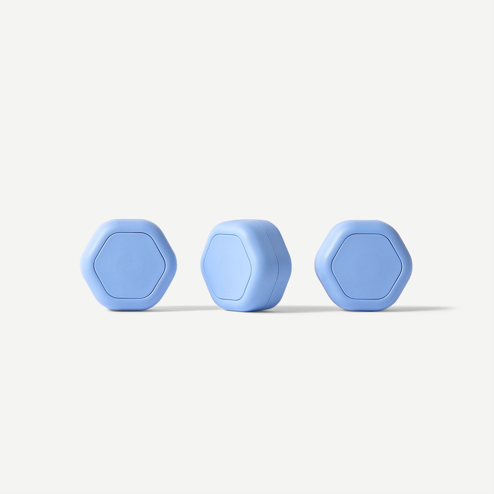 Three blue hexagonal objects on a white background