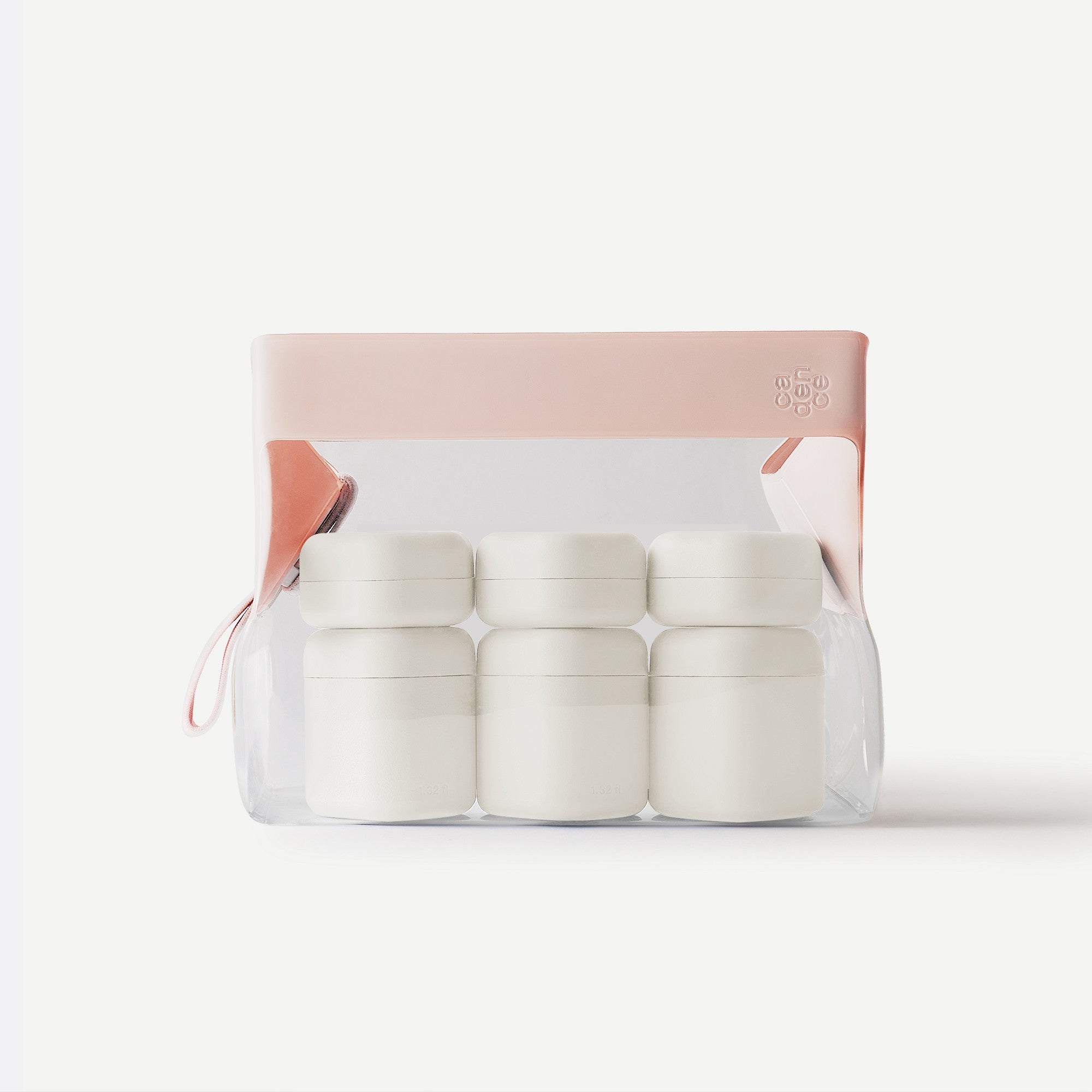 Set of white containers in a clear plastic pack with a pink lid on a white background