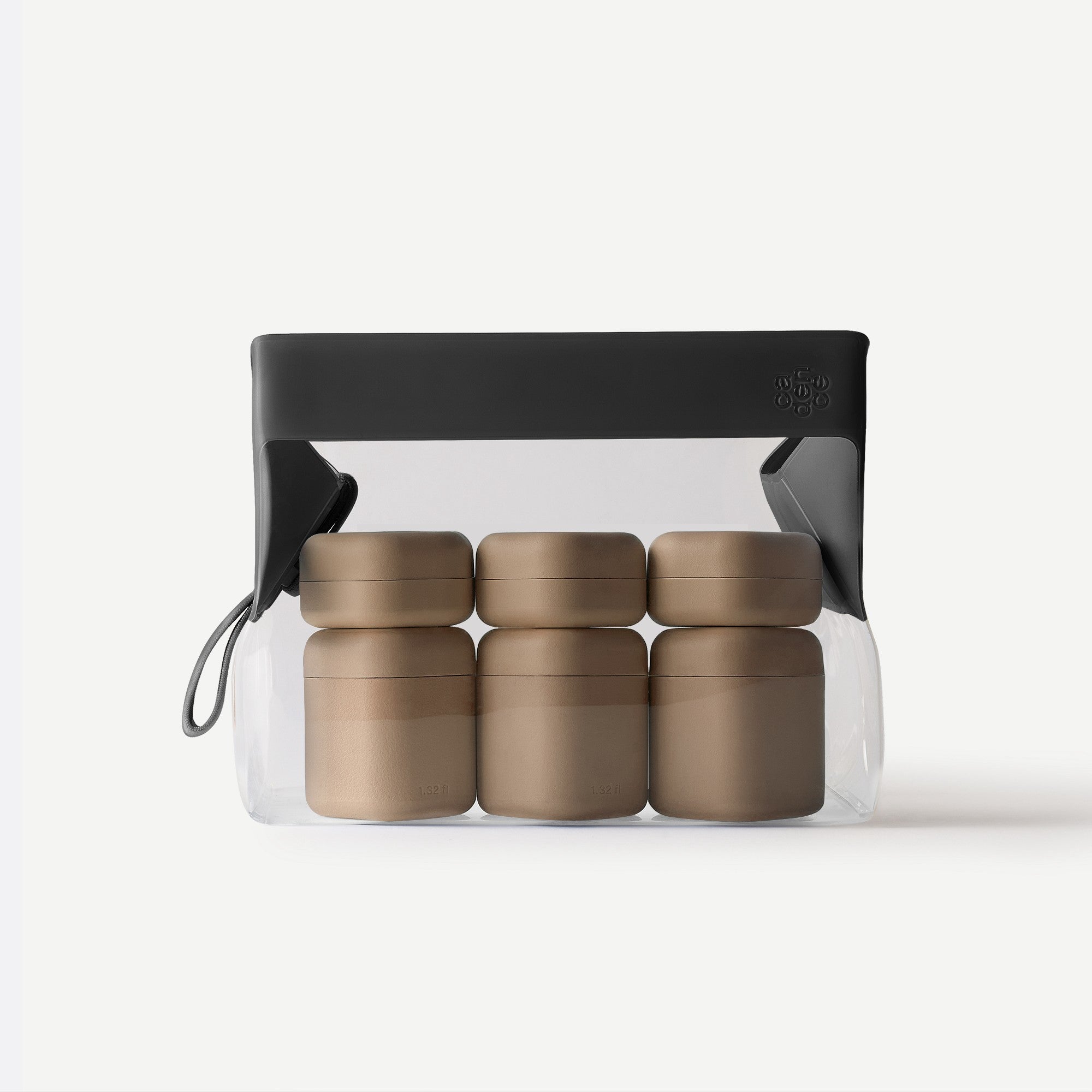 Set of five gold containers in a clear plastic pack with a black lid on a white background