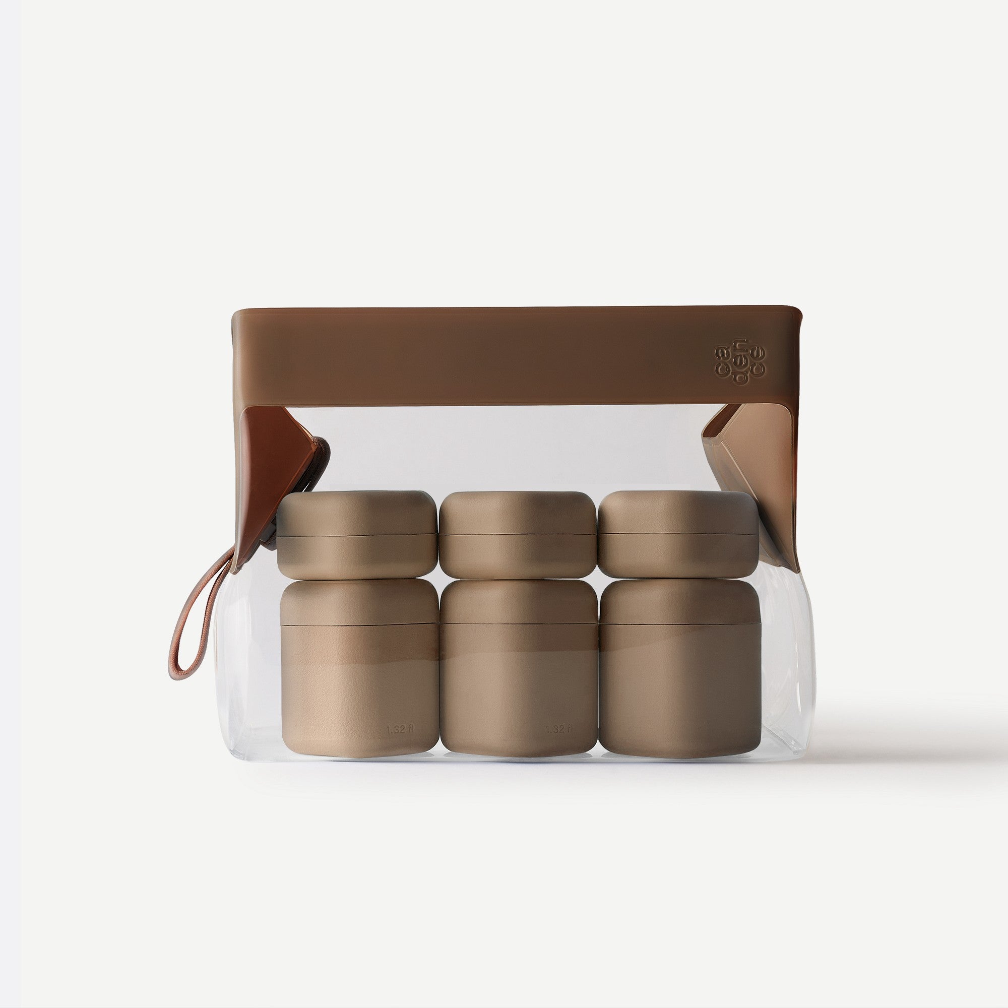 Set of five gold containers in a clear plastic pack with a brown handle on a white background