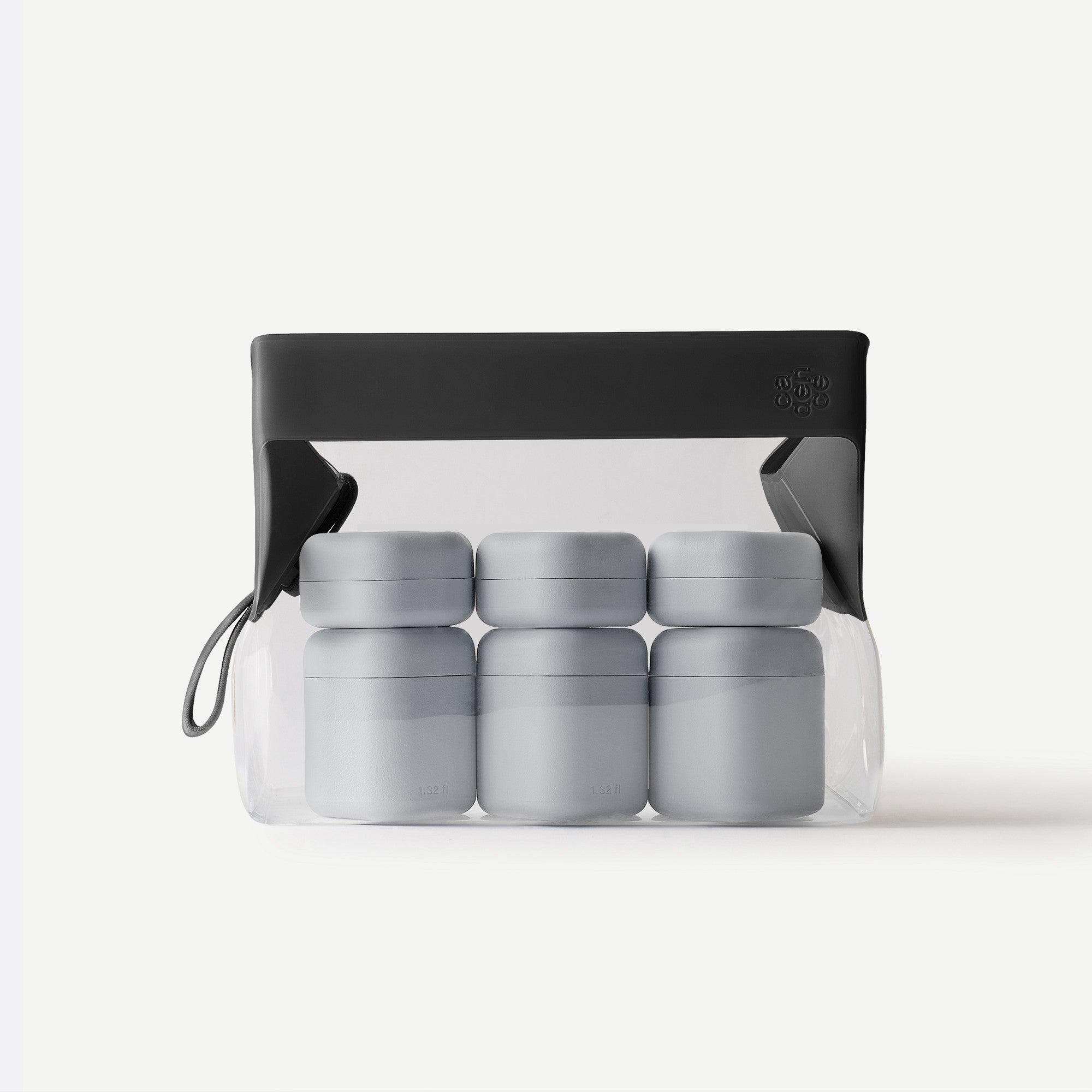 Set of gray containers in a transparent packaging with a black lid on a white background