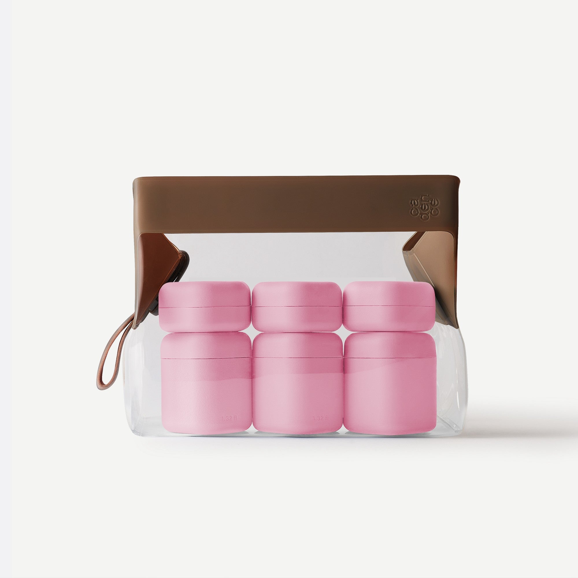 Set of pink containers in clear packaging with a brown lid on a white background