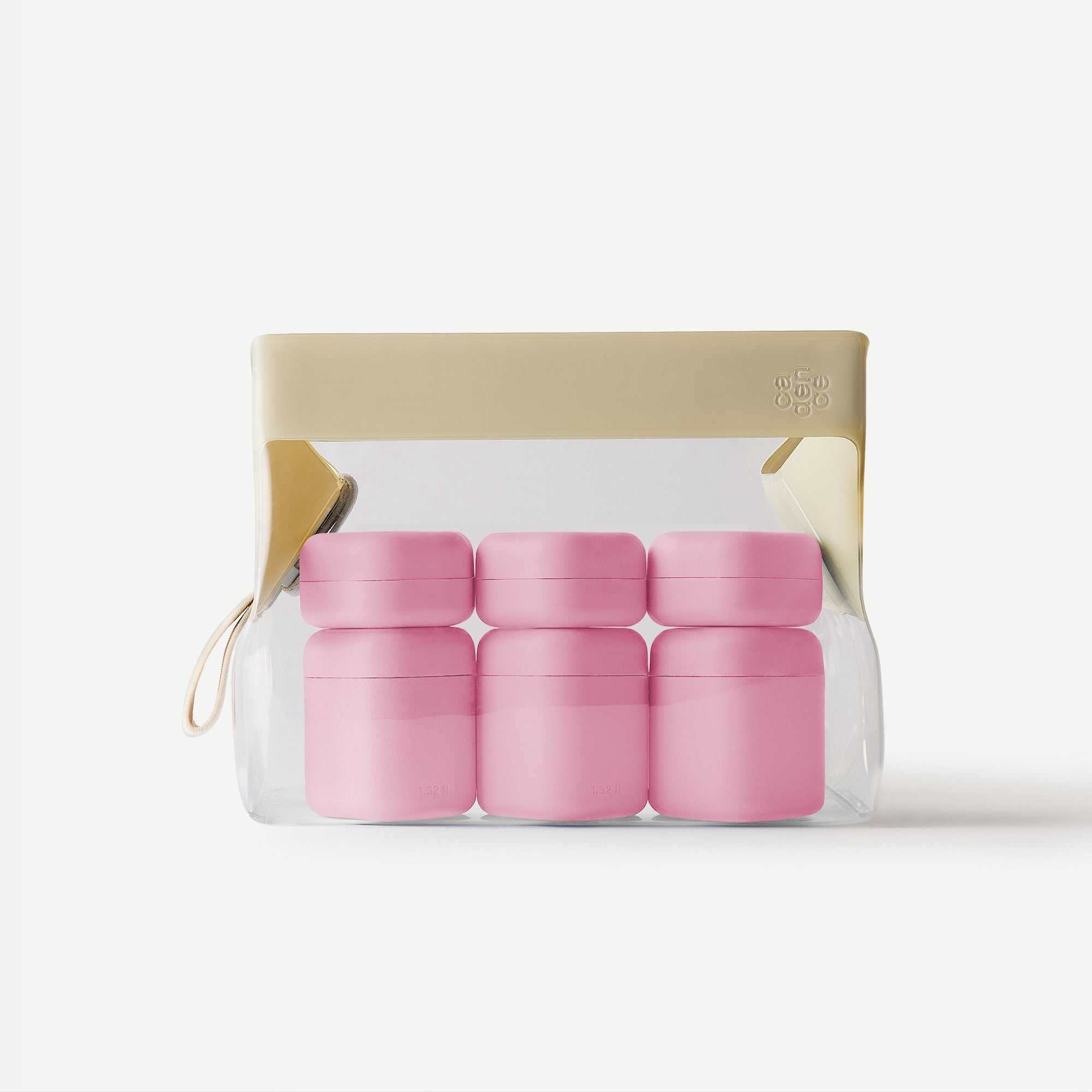 Set of pink containers in a clear packaging on a white background