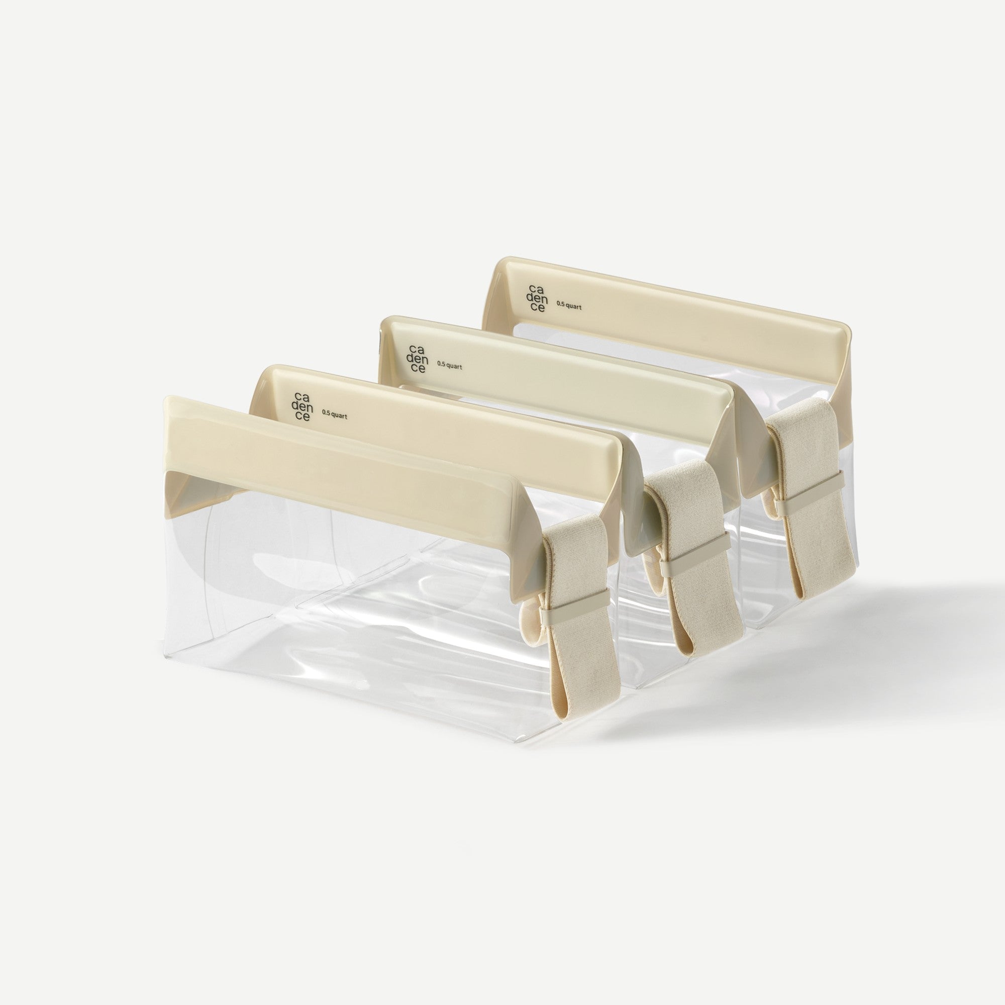 Set of clear plastic trays with beige borders on a white background