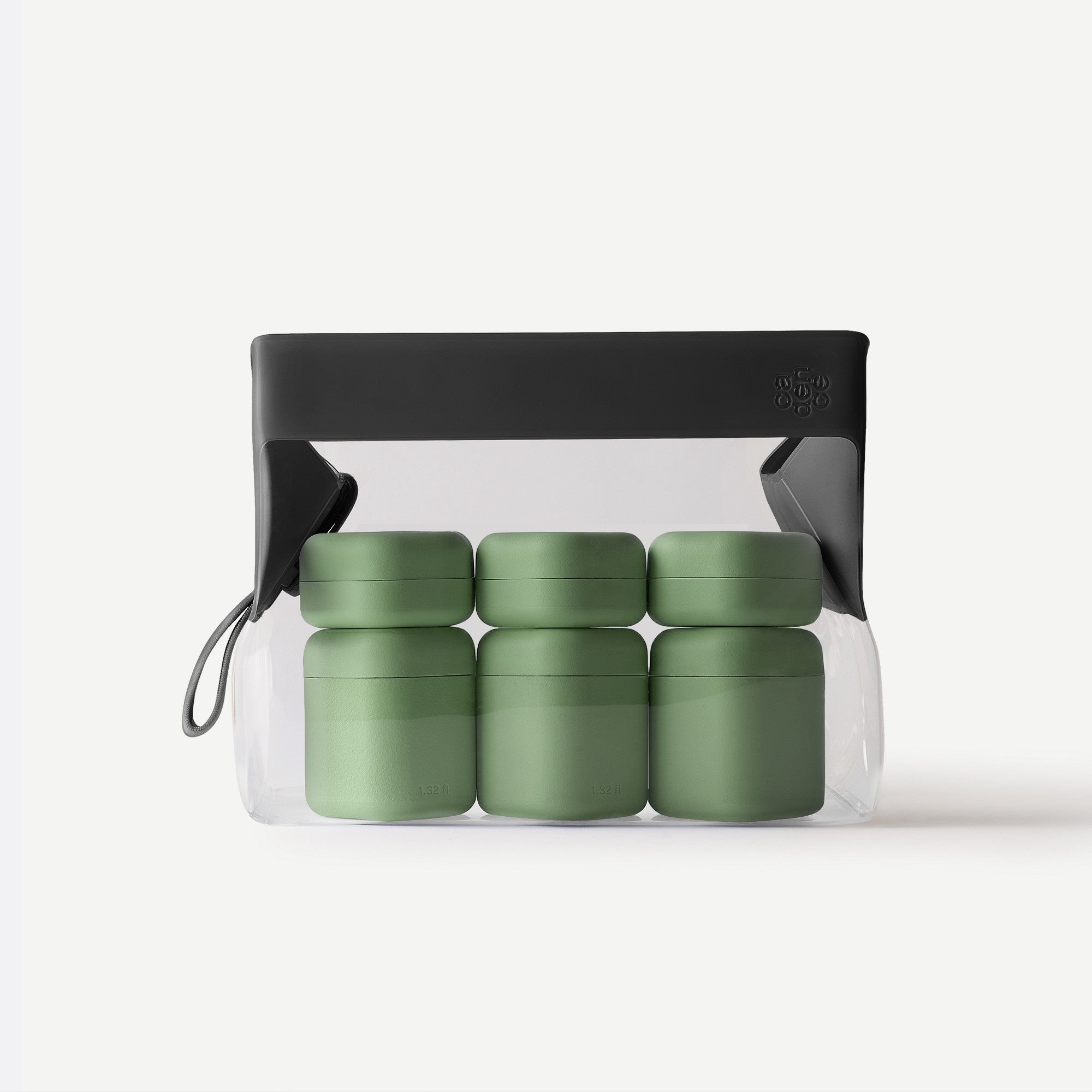 Set of green containers in a clear plastic pack with a black lid on a white background