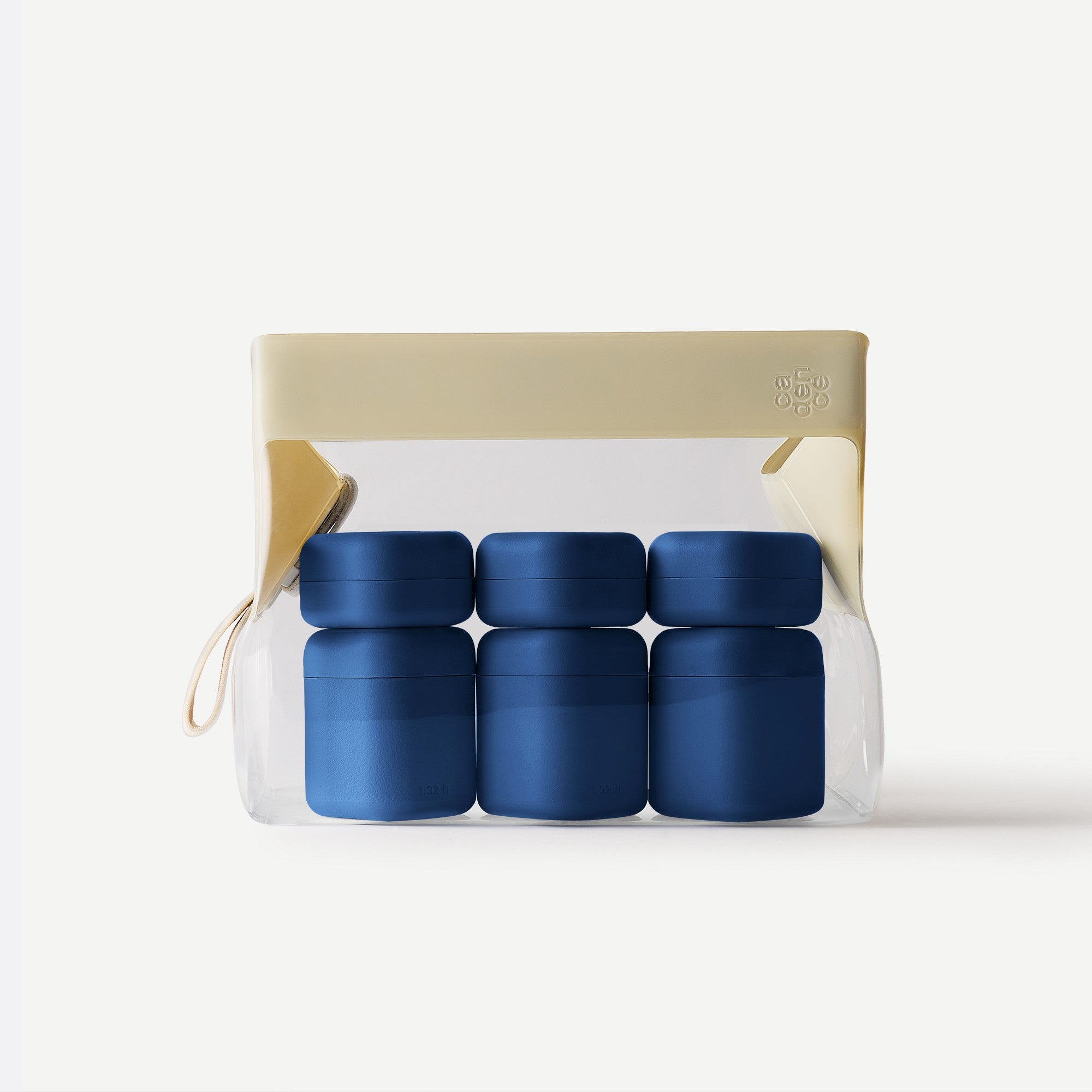 Set of blue containers in a clear package with beige top on a white background