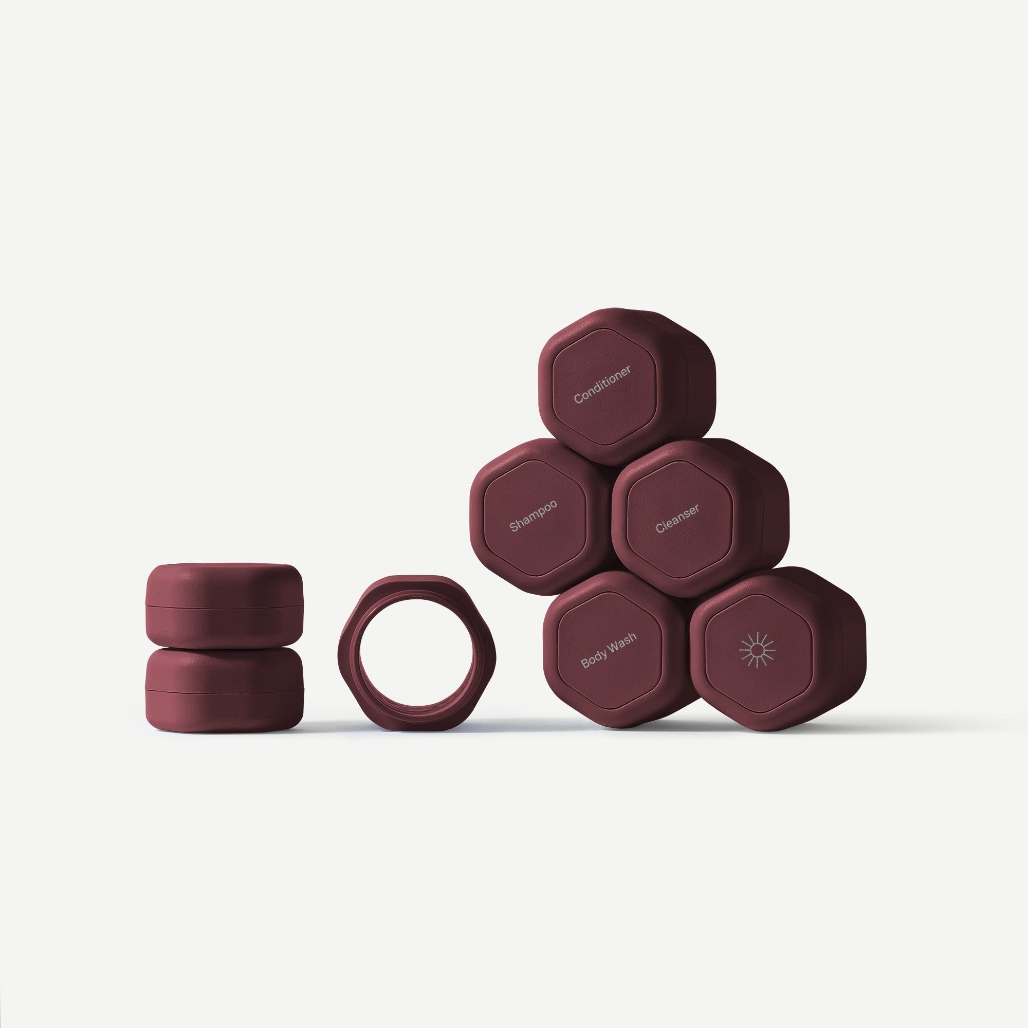 Set of gray hexagonal containers with labels on a white background