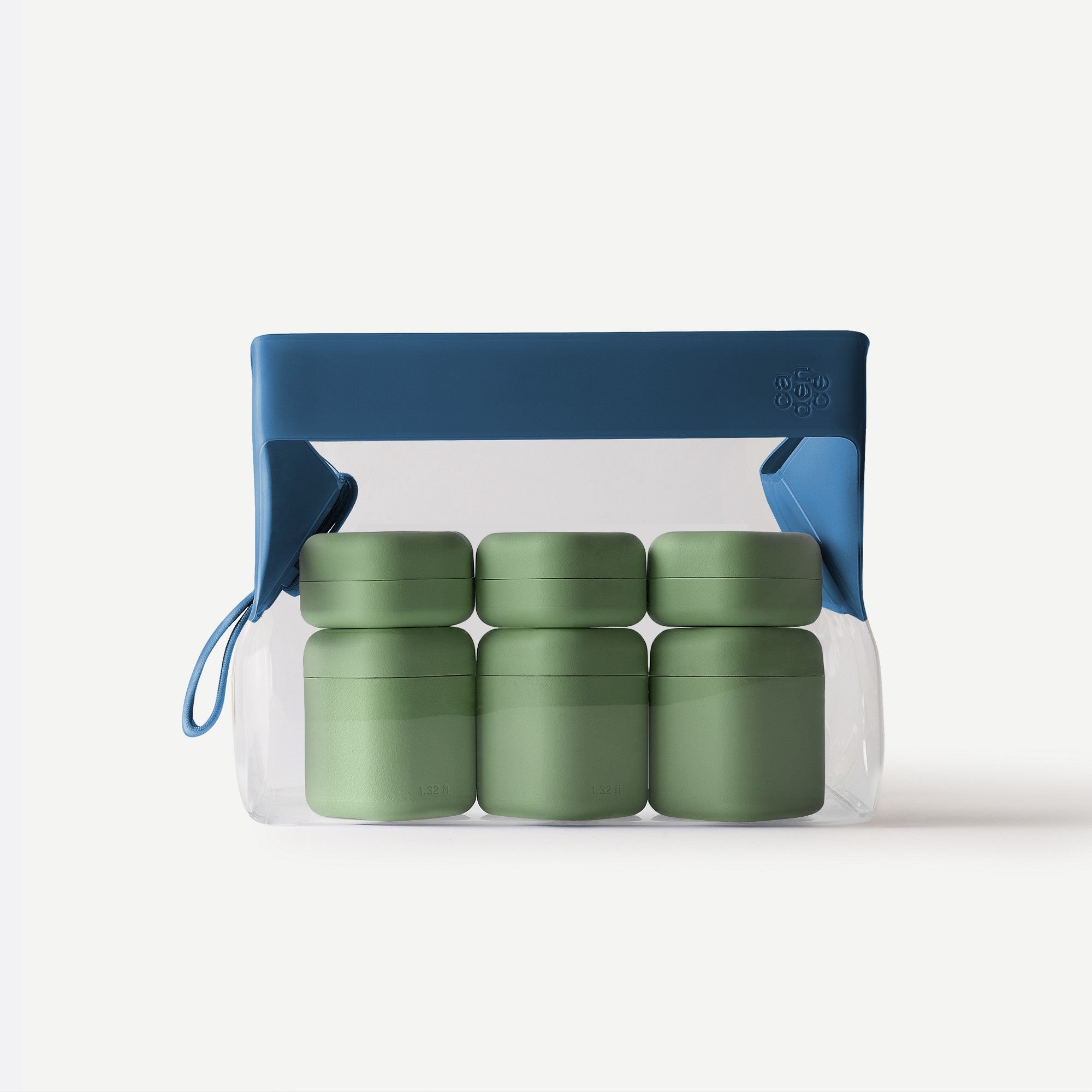 Set of green containers in a clear plastic bag with a blue carrying handle on a white background