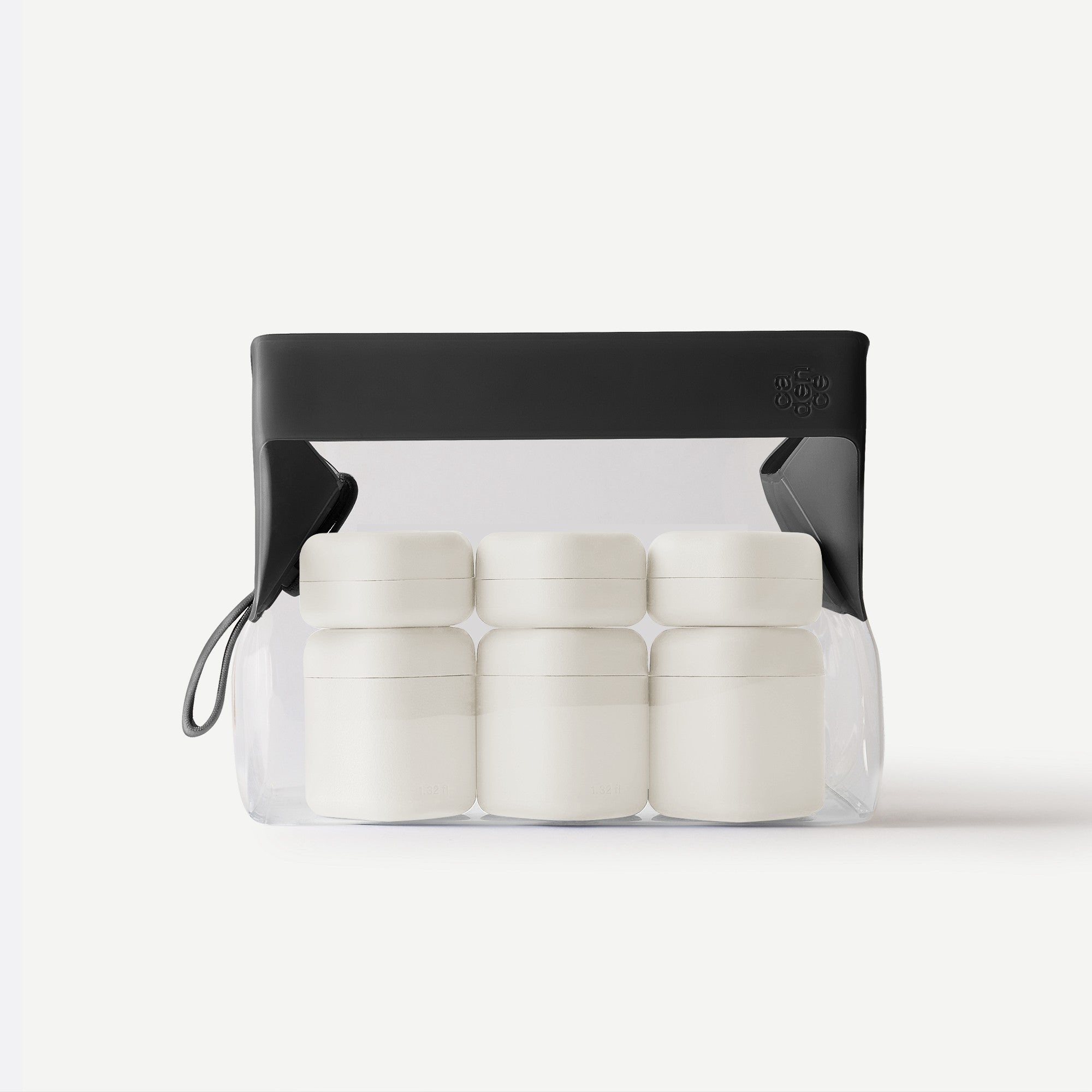 Clear container with white cylindrical objects and a black lid on a white background