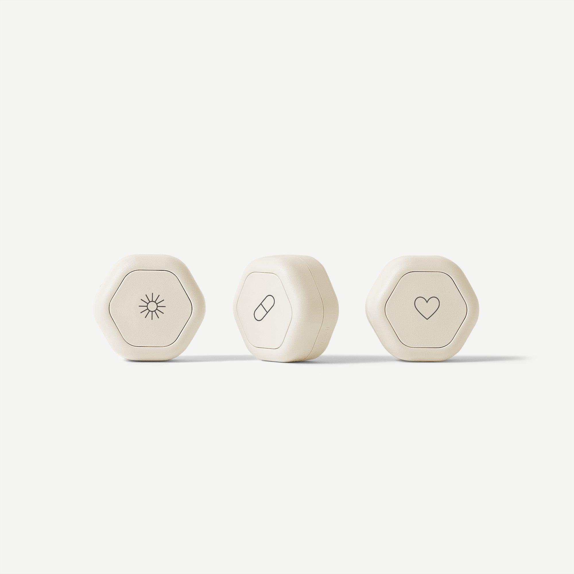 Three hexagonal devices with different symbols on a white background