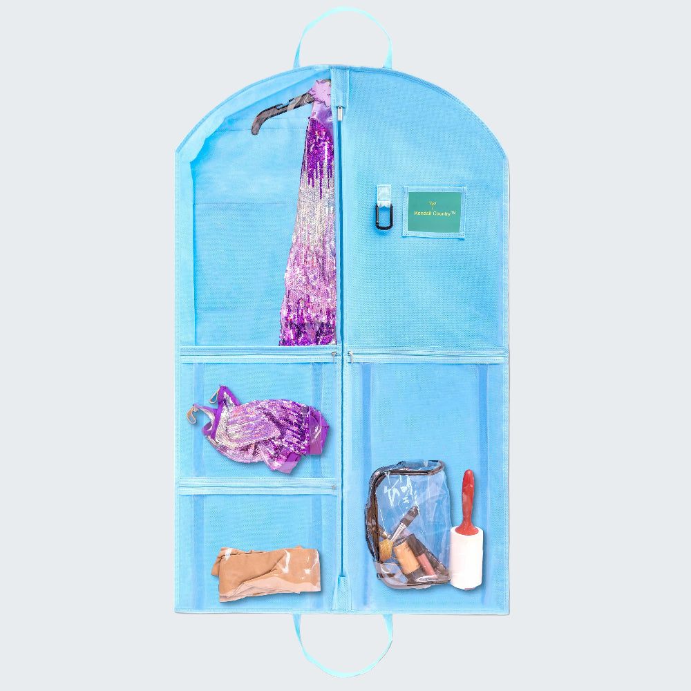 A light blue hanging garment organizer with multiple pockets and compartments, shown against a white background. The organizer is filled with various travel and dressing accessories, including a purple sequined scarf, a small bottle, a clear pouch, and a lint roller.