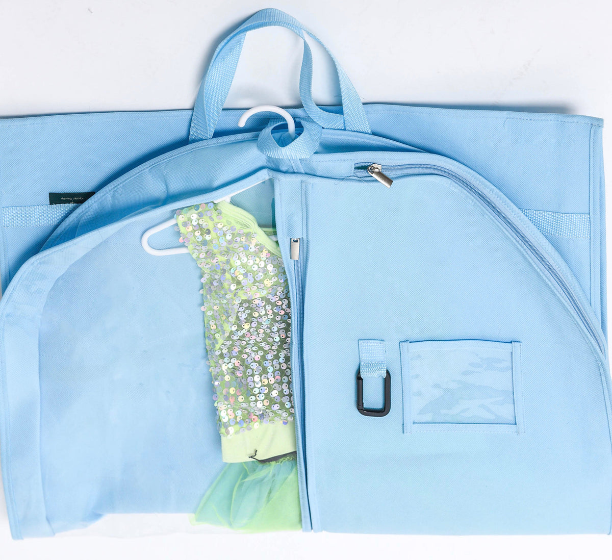 A light blue garment bag laid flat on a white background, shown open with a sequined light green dress hanging inside. The bag has top handles, a zipper closure, a front pocket with a clear window and black buckle, and side pockets.